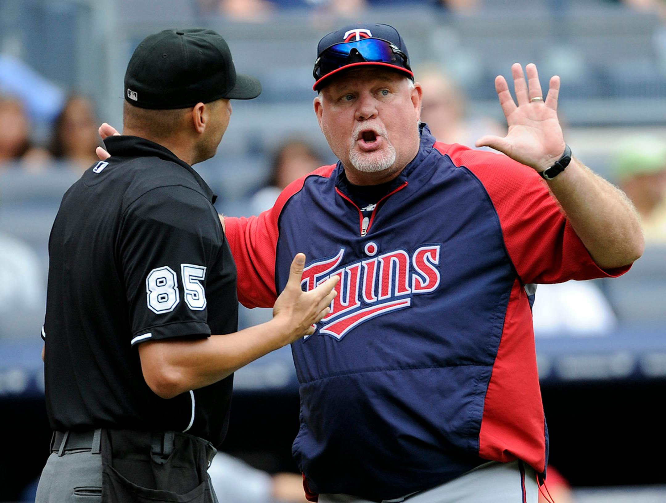 Minnesota Twins manager Ron Gardenhire argues with home plate umpire Vic Carapazza during the eighth inning of a baseball game against the New York Yankees Saturday, July 13, 2013, at Yankee Stadium in New York. (AP Photo/Bill Kostroun) ORG XMIT: MIN2013071315020305 ORG XMIT: MIN1307251943312573