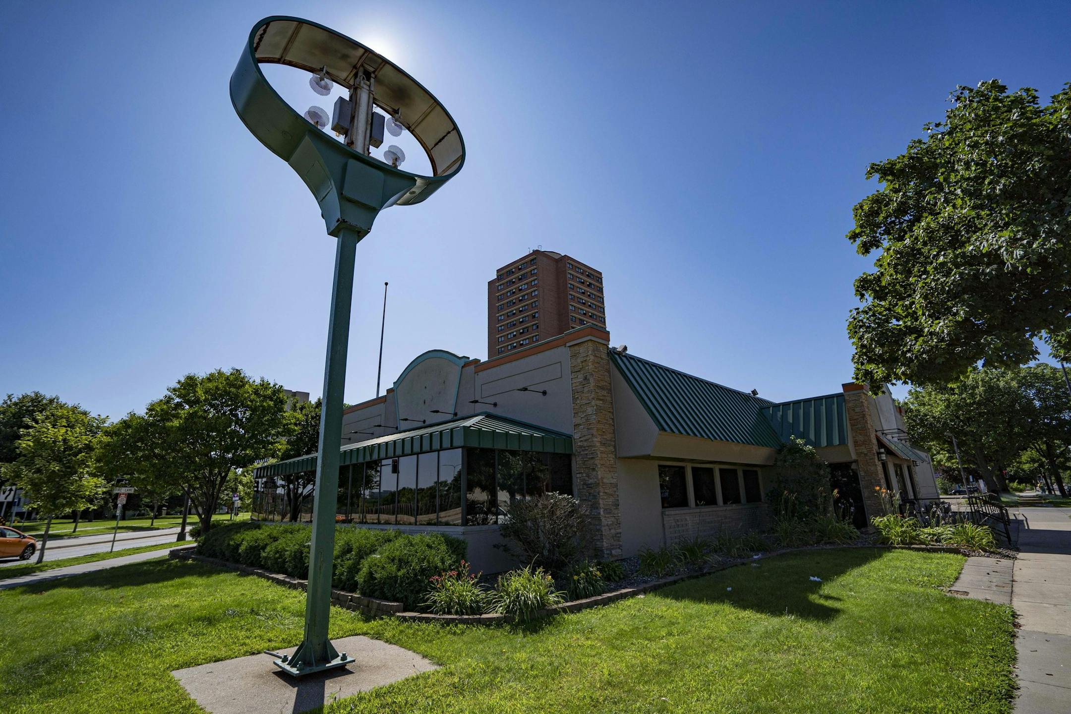 In this Tuesday, July 30, 2019 photo, the logo and sign have been removed from the Perkins restaurant in Minneapolis. The last Perkins in Minneapolis city limits, adjacent to the Cedar-Riverside neighborhood, closed its doors on July 14. Sunday mornings on Riverside Avenue won't be the same with the recent closure of its Perkins Restaurant & Bakery, a long-standing area staple. (Tony Saunders/The Minnesota Daily via AP)