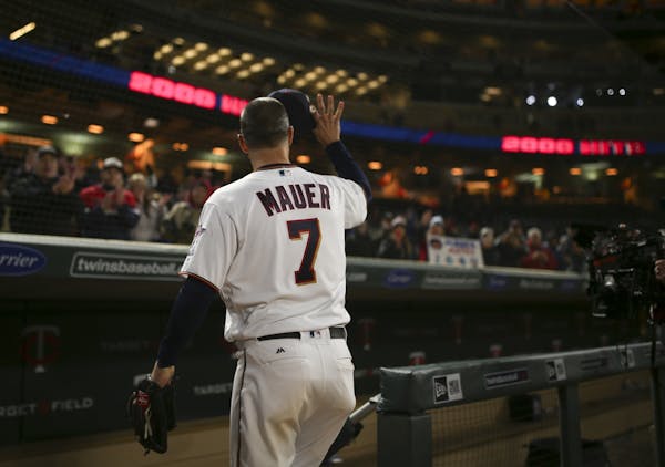 Joe Mauer acknowledged fans while heading to the clubhouse after being interviewed post-game.