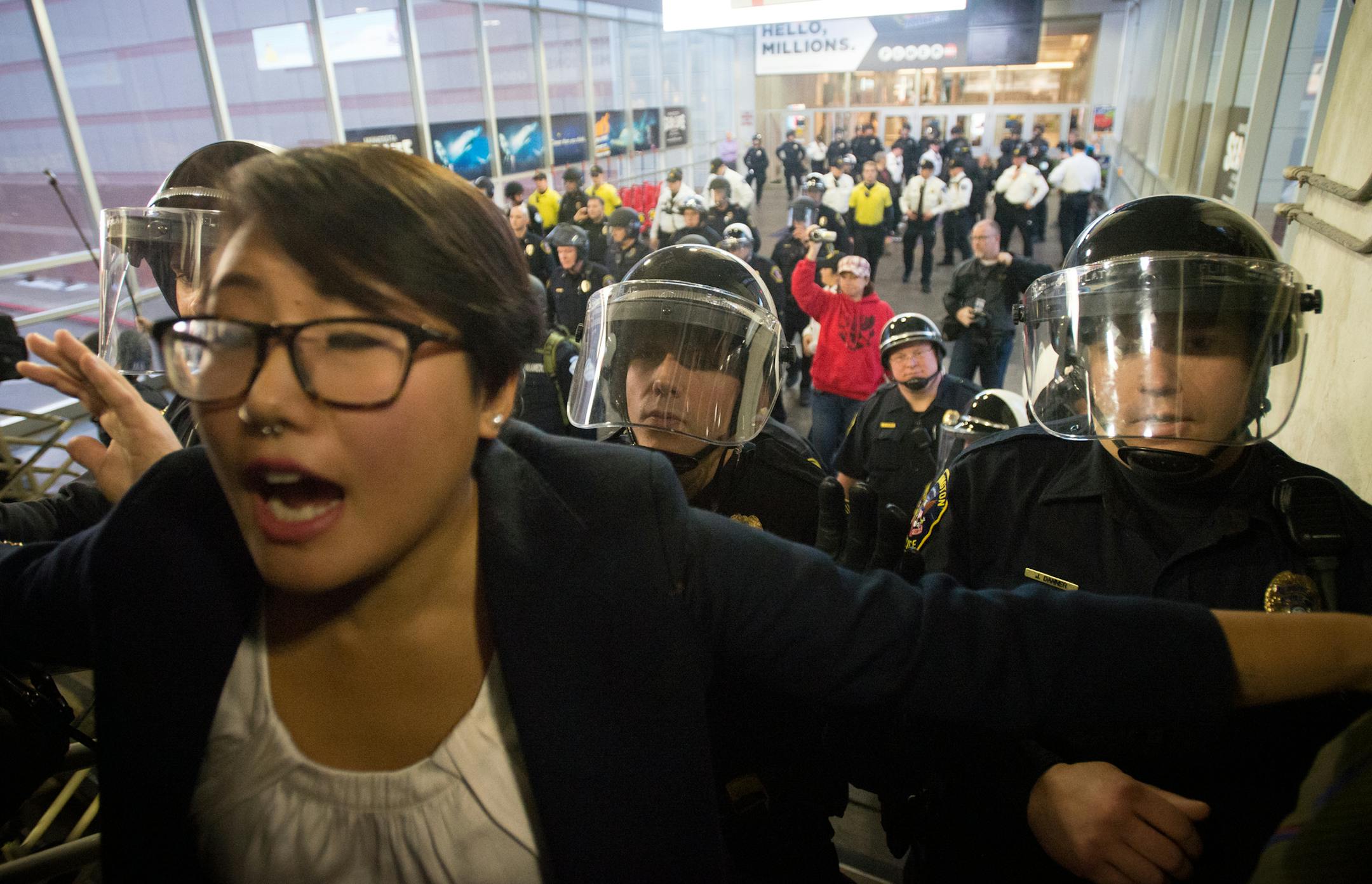Police in riot gear chant "move" as they begin marching on protestors that remained on a second-floor bridge linking the Mall of America to the east parking garage. ] AARON LAVINSKY ‚Ä¢ aaron.lavinsky@startribune.com Black Lives Matter protestors demonstrate at Mall of America Saturday, Dec. 20, 2014 in Minneapolis. ORG XMIT: MIN1412201734370080