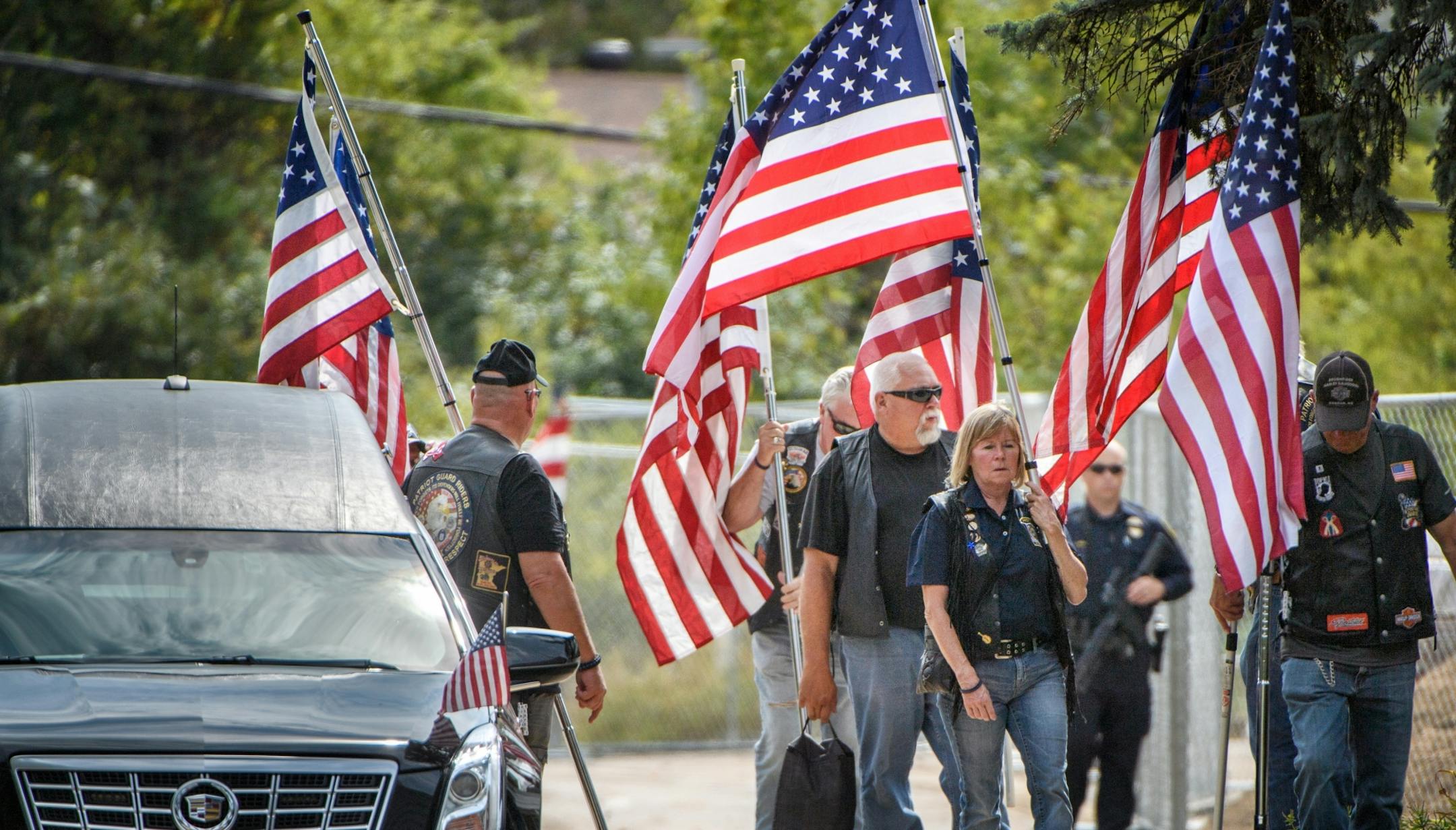 Members of the Patriot Guard gather at the entrance of Wayzata Free Church for the visitation of Wayzata police officer Bill Mathews, who was struck and killed by a motorist last week on Hwy. 12.