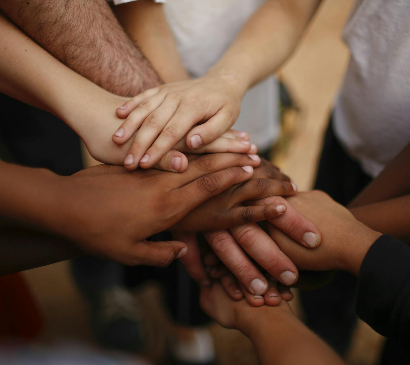 Bryant Square players piled their hands on top of one another when they gathered at the end of a practice last month at their home field. ] JEFF WHEELER &#x201a;&#xc4;&#xa2; jeff.wheeler@startribune.com Bryant Square Park rec center little league team had a practice on their home field Tuesday night, June 17, 2014.