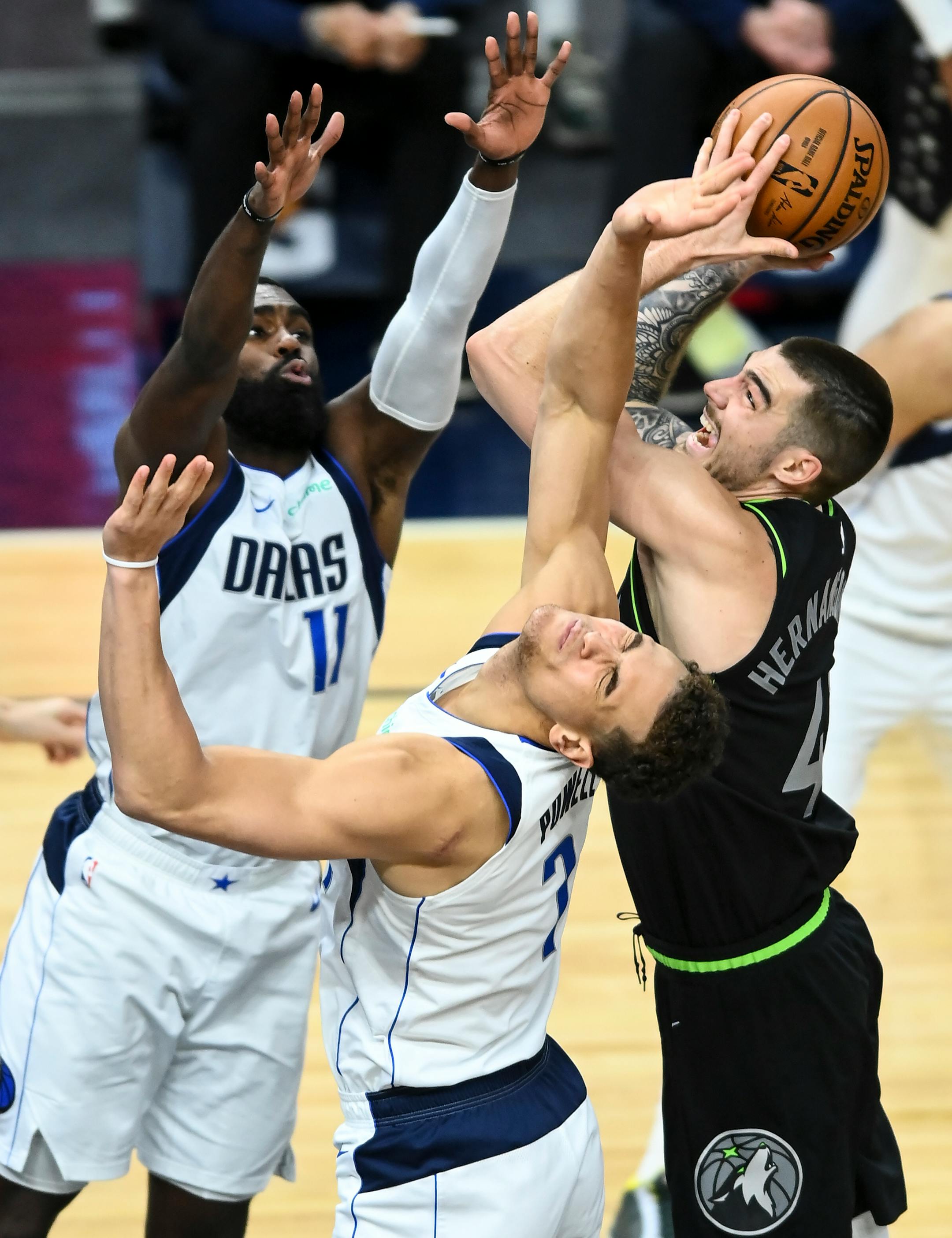 Minnesota Timberwolves forward Juancho Hernangomez (41) attacked the rim but missed as he was fouled by Dallas Mavericks center Dwight Powell (7) in the second half.