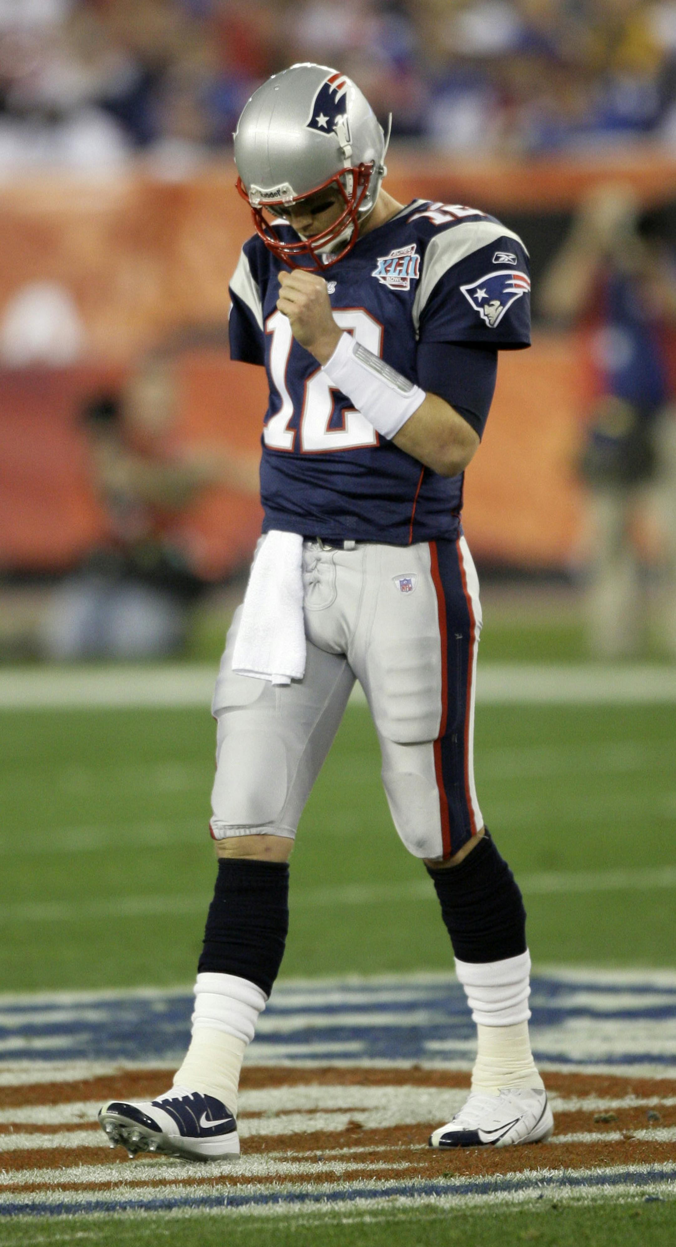 New England Patriots quarterback Tom Brady (12) is seen during the Super Bowl XLII football game against the New York Giants at University of Phoenix Stadium on Sunday, Feb. 3, 2008 in Glendale, Ariz. (AP Photo/David J. Phillip) ORG XMIT: NYEOTK