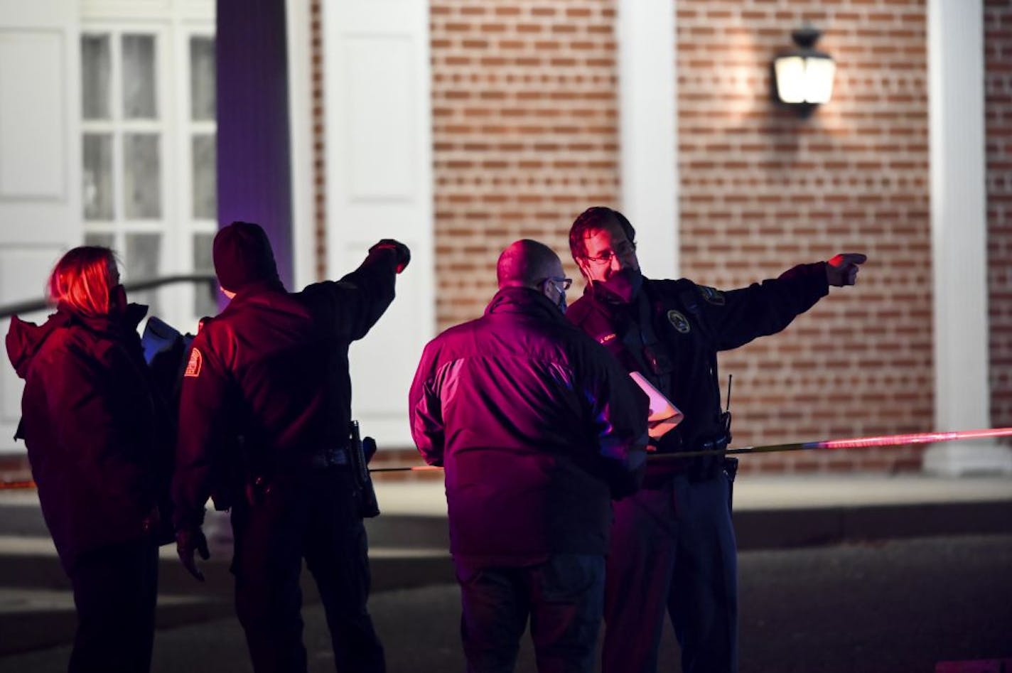 St. Paul police officers and Bureau of Criminal Apprehension (BCA) investigators walked Saturday near the scene of an earlier shooting in which St. Paul police shot a man near Rice Street and Magnolia.