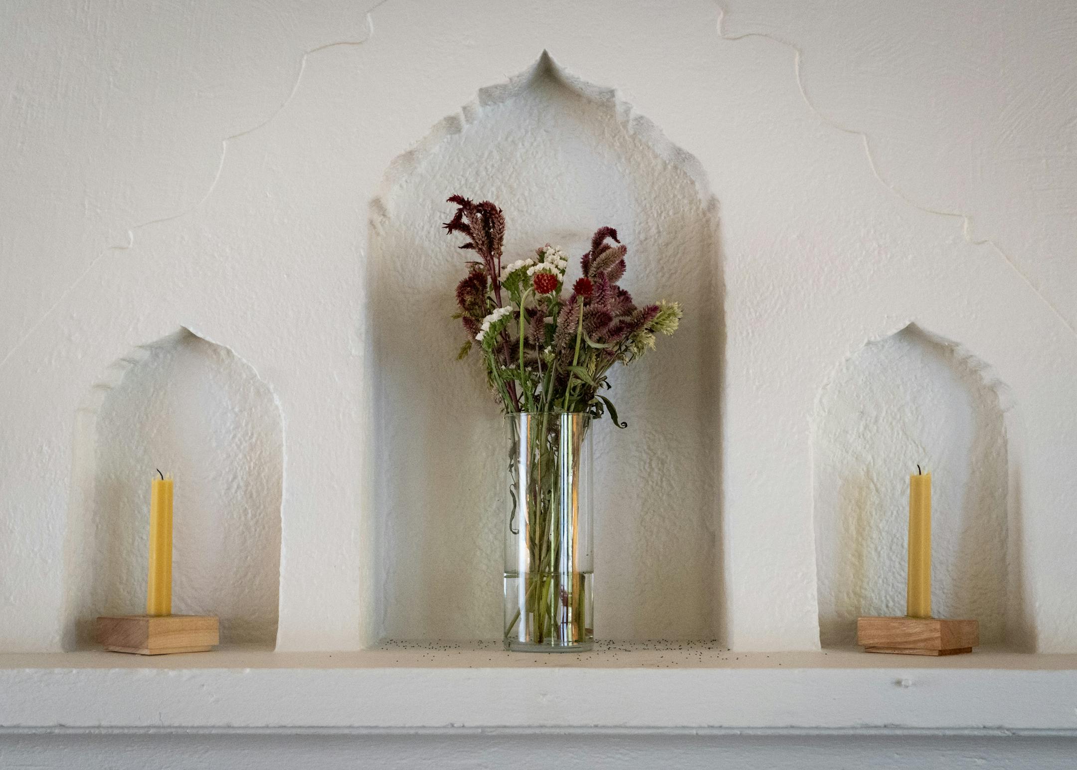 Arched niches above the fireplace.