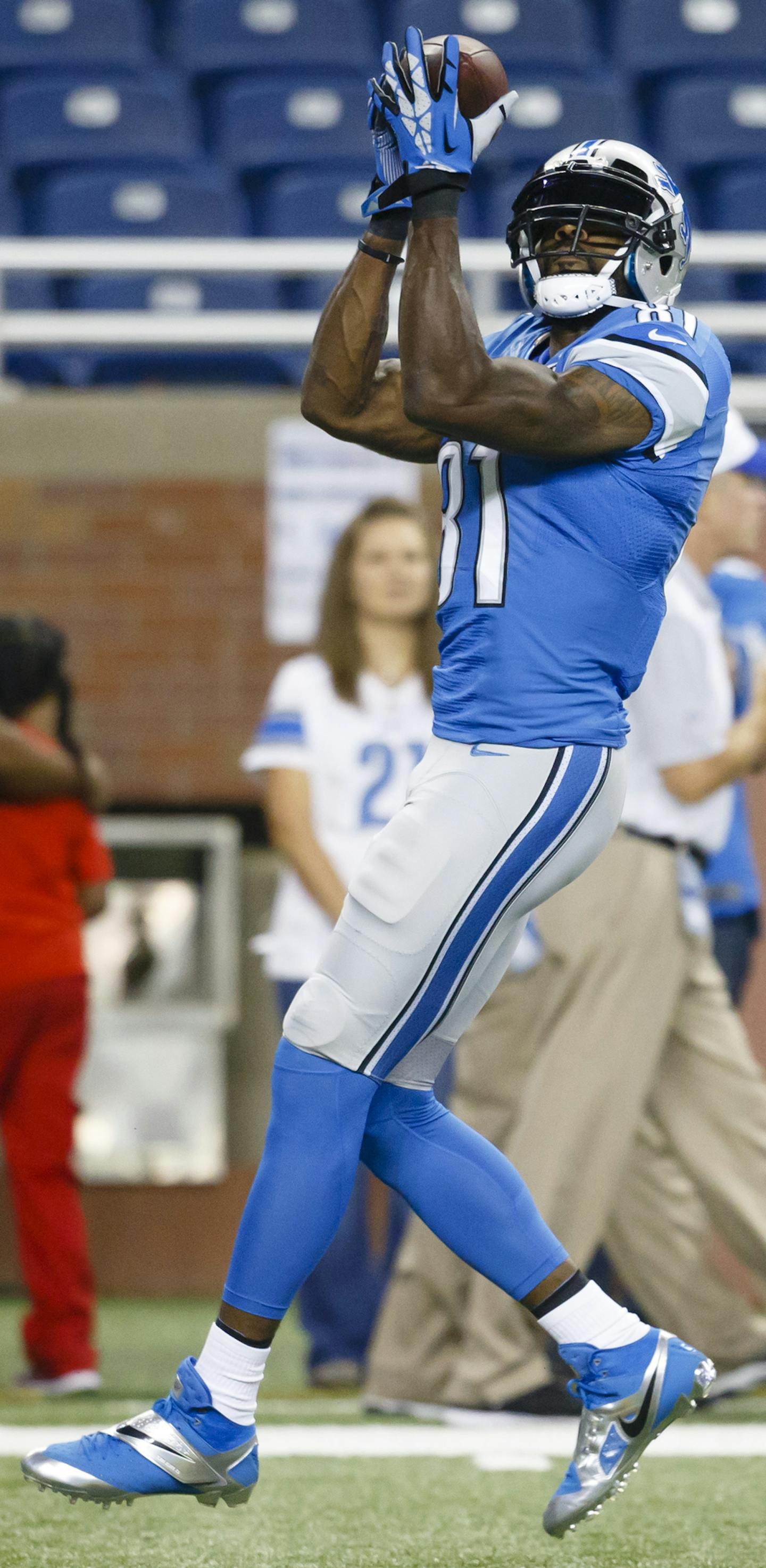 Detroit Lions wide receiver Calvin Johnson (81) warms up before an preseason NFL football game against the Buffalo Bills at Ford Field in Detroit, Thursday, Sept. 3, 2015. (AP Photo/Rick Osentoski) ORG XMIT: MIN2015091917114128