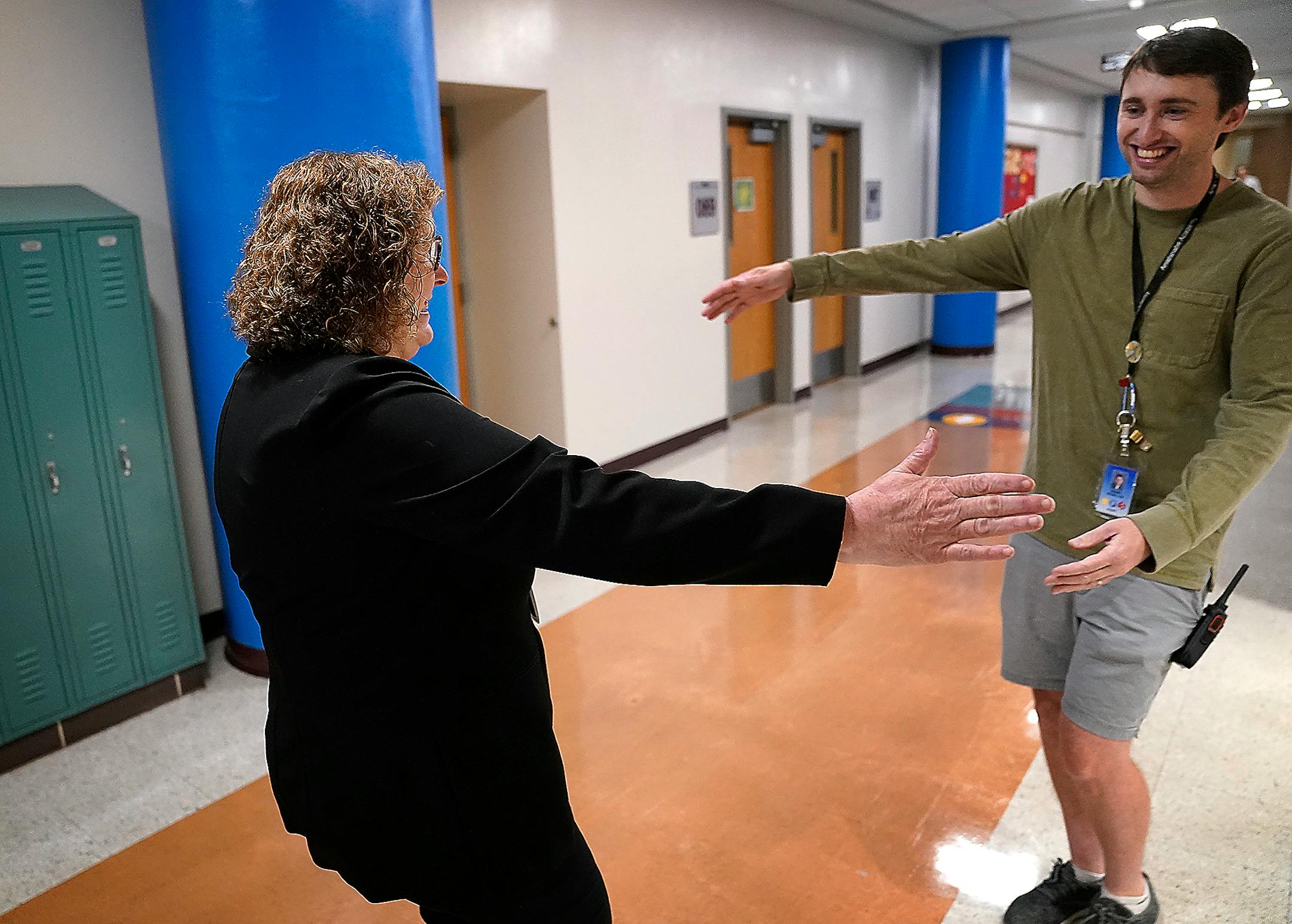 Interim Minneapolis Public Schools Superintendent Rochelle Cox, greeted Anishinabe Academy educator Daniel McMillan with a hug on the first day of school in Minneapolis.