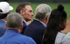 Former Minnesota Twins manager Paul Molitor sat on the field during a pregame ceremony to retire Twins great Joe Mauer's number 7 Saturday. ] ANTHONY 