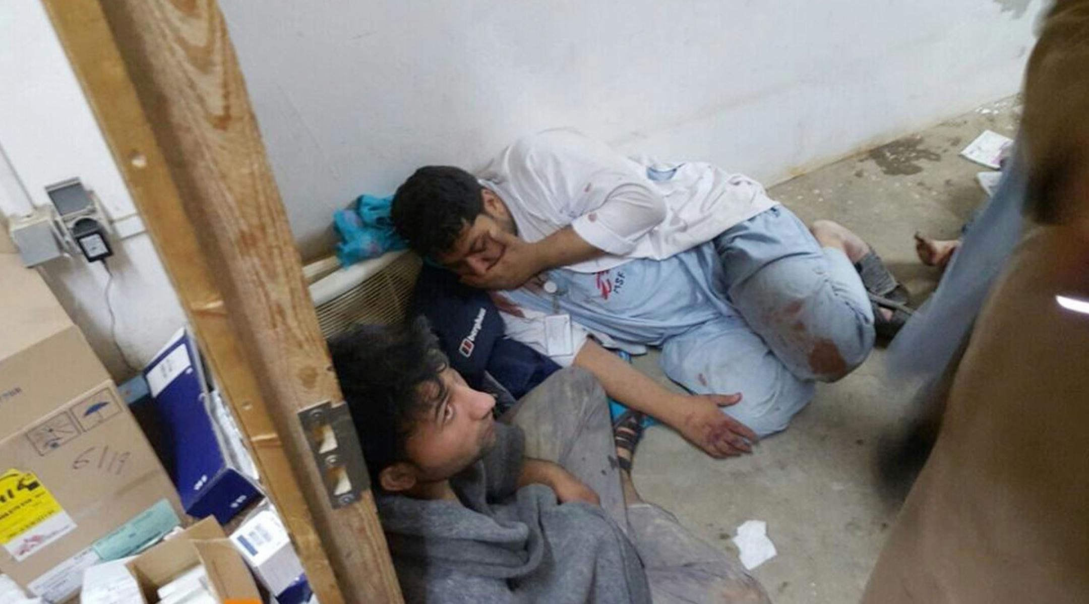 Injured Doctors Without Borders staff are seen after explosions near their hospital in the northern Afghan city of Kunduz, Saturday, Oct. 3, 2015. Doctors Without Borders announced that the death toll from the bombing of the group's Kunduz hospital compound has risen to at least 16, including 3 children and that tens are missing after the explosions that may have been caused by a U.S. airstrike. In a statement, the international charity said the "sustained bombing" took place at 2:10 a.m. (21:40