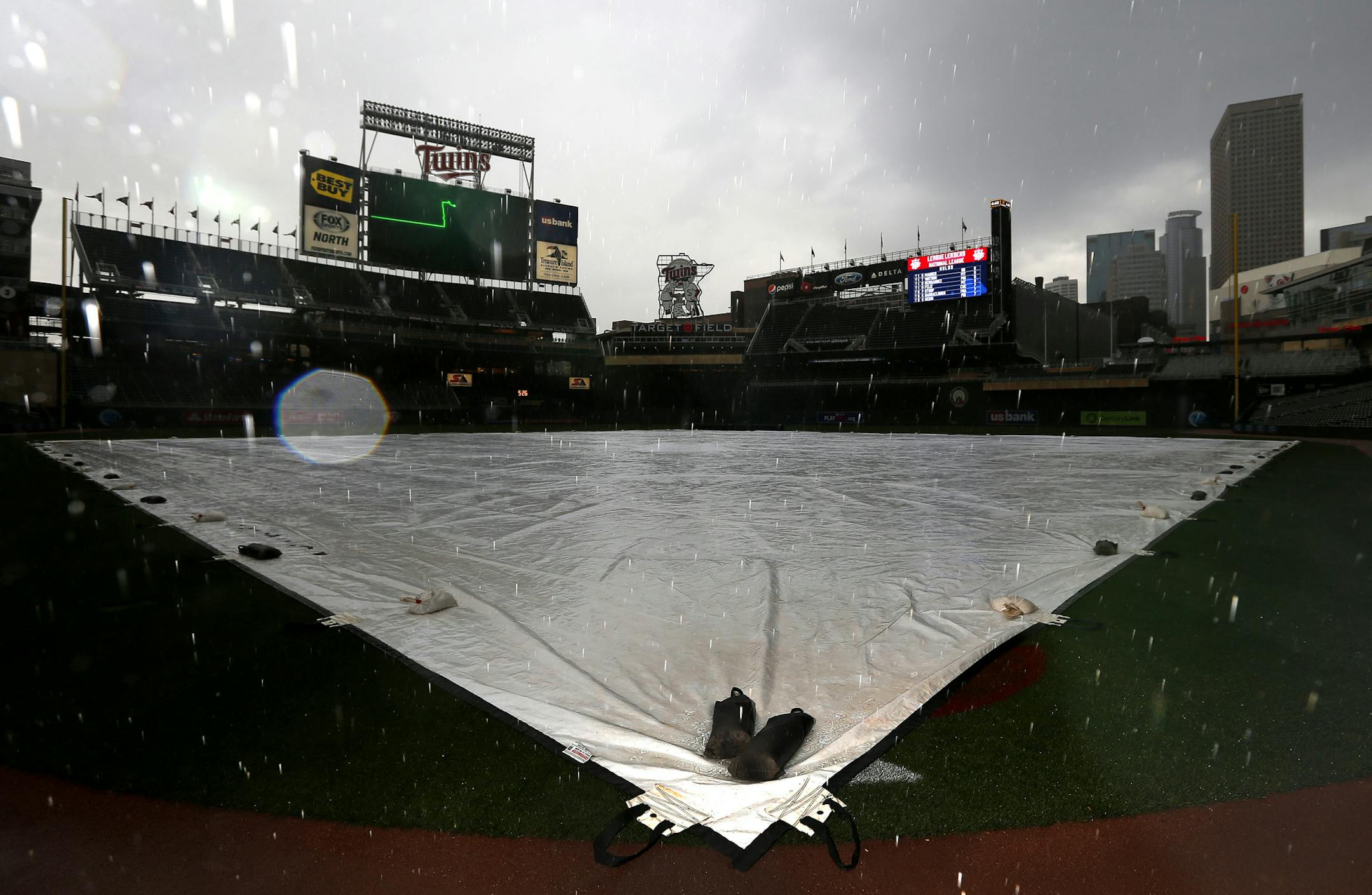 A tarp covered the infield at Target Field as the rain fell before Monday night's game. ] CARLOS GONZALEZ cgonzalez@startribune.com - May 9, 2016, Minneapolis, MN, Target Field, MLB, Minnesota Twins vs. Baltimore Orioles
