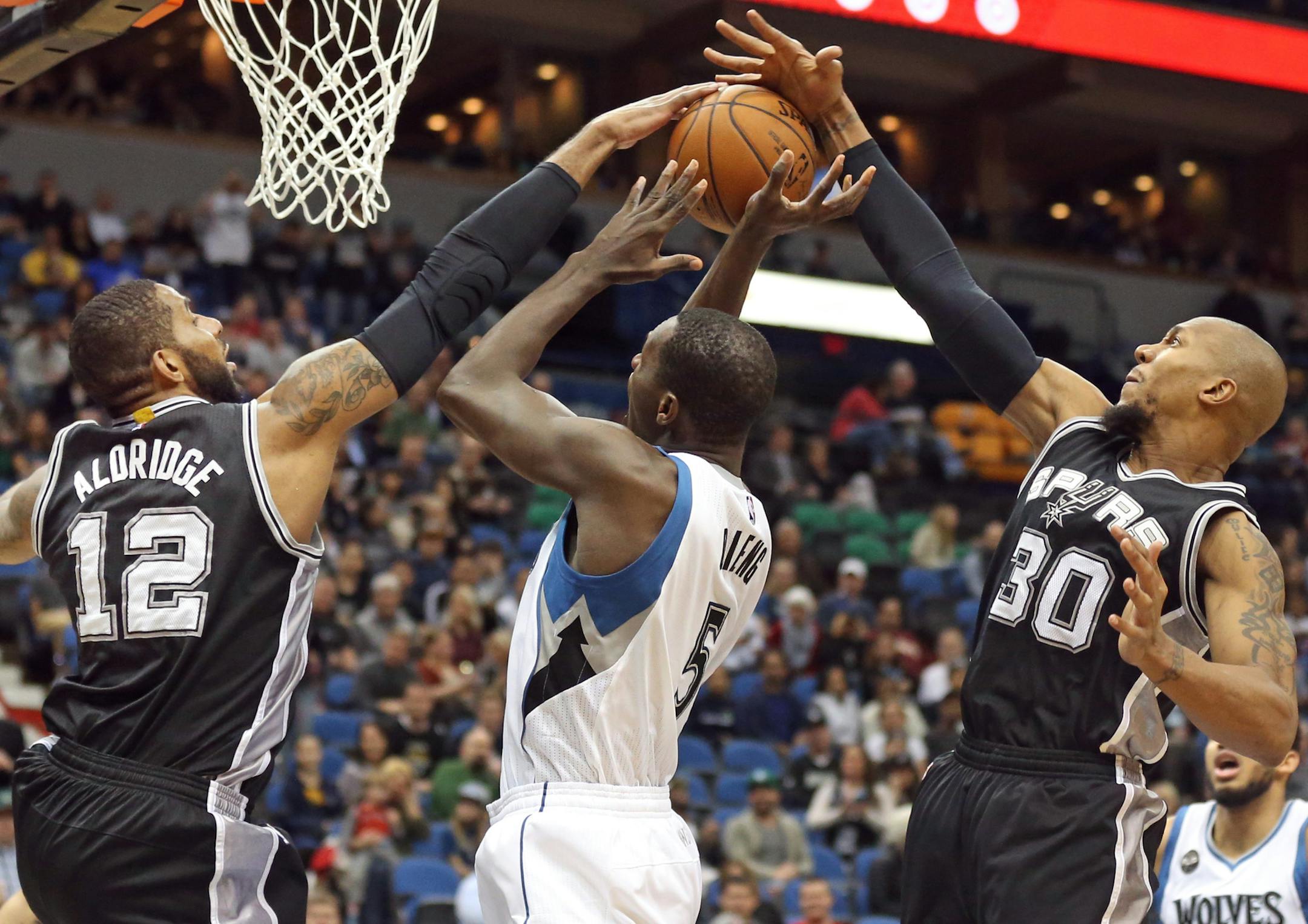San Antonio Spurs LaMarcus Aldridge left and forward David West (30) blocked a shot attempt of Minnesota Timberwolves center Gorgui Dieng (5) at Target Center Tuesday March 8, 2016 in Minneapolis , MN. ] The Minnesota Timberwolves hosted the San Antonio Spurs. Jerry Holt/Jerry.Holt@Startribune.com