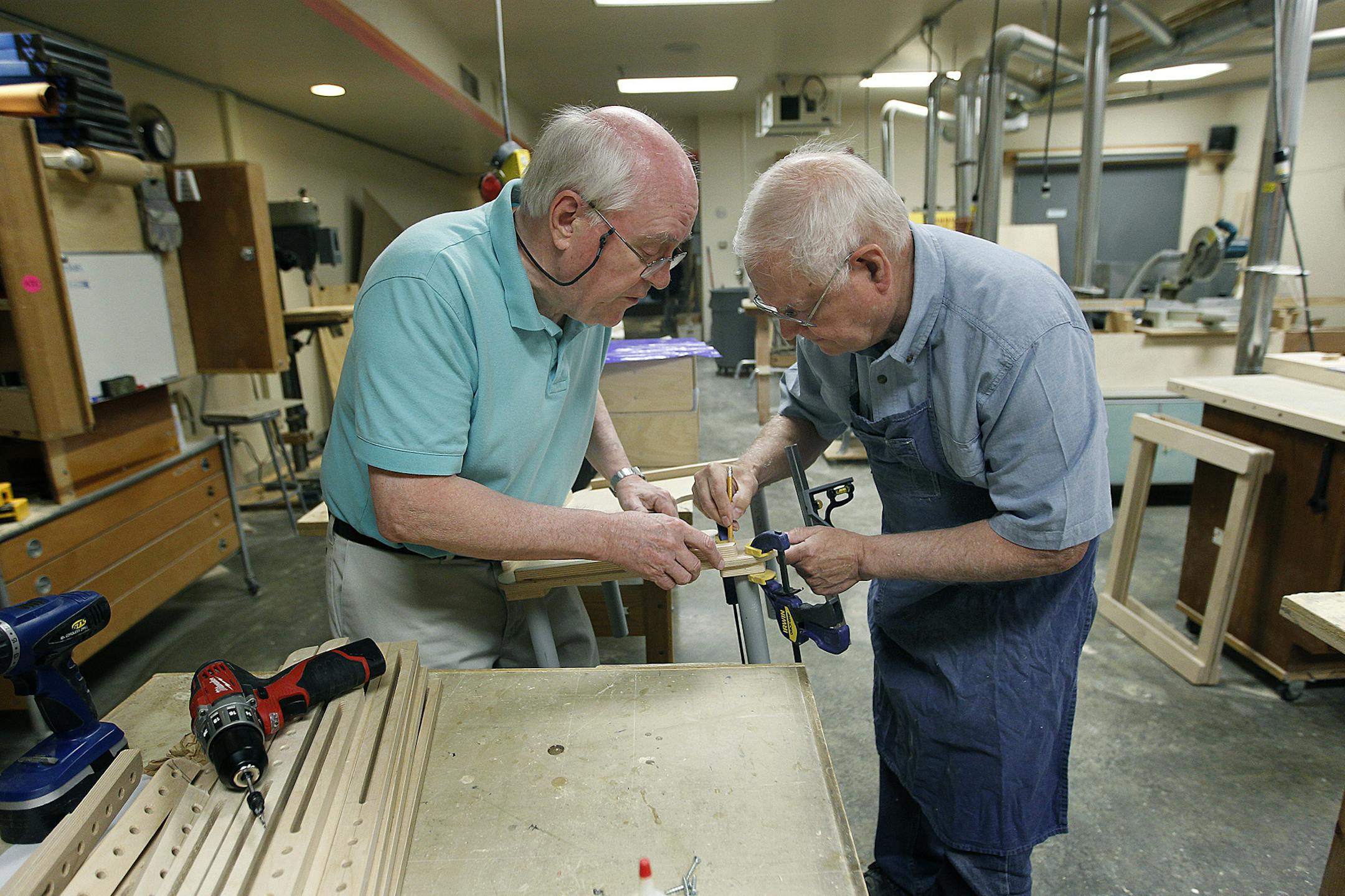 Jim Murray, 78, left, and Duane Gemelke, 67, both Honeywell retirees, worked on a small bench for a special needs student at North Star School, Tuesday, June 4, 2013. (ELIZABETH FLORES/STAR TRIBUNE) ELIZABETH FLORES • eflores@startribune.com