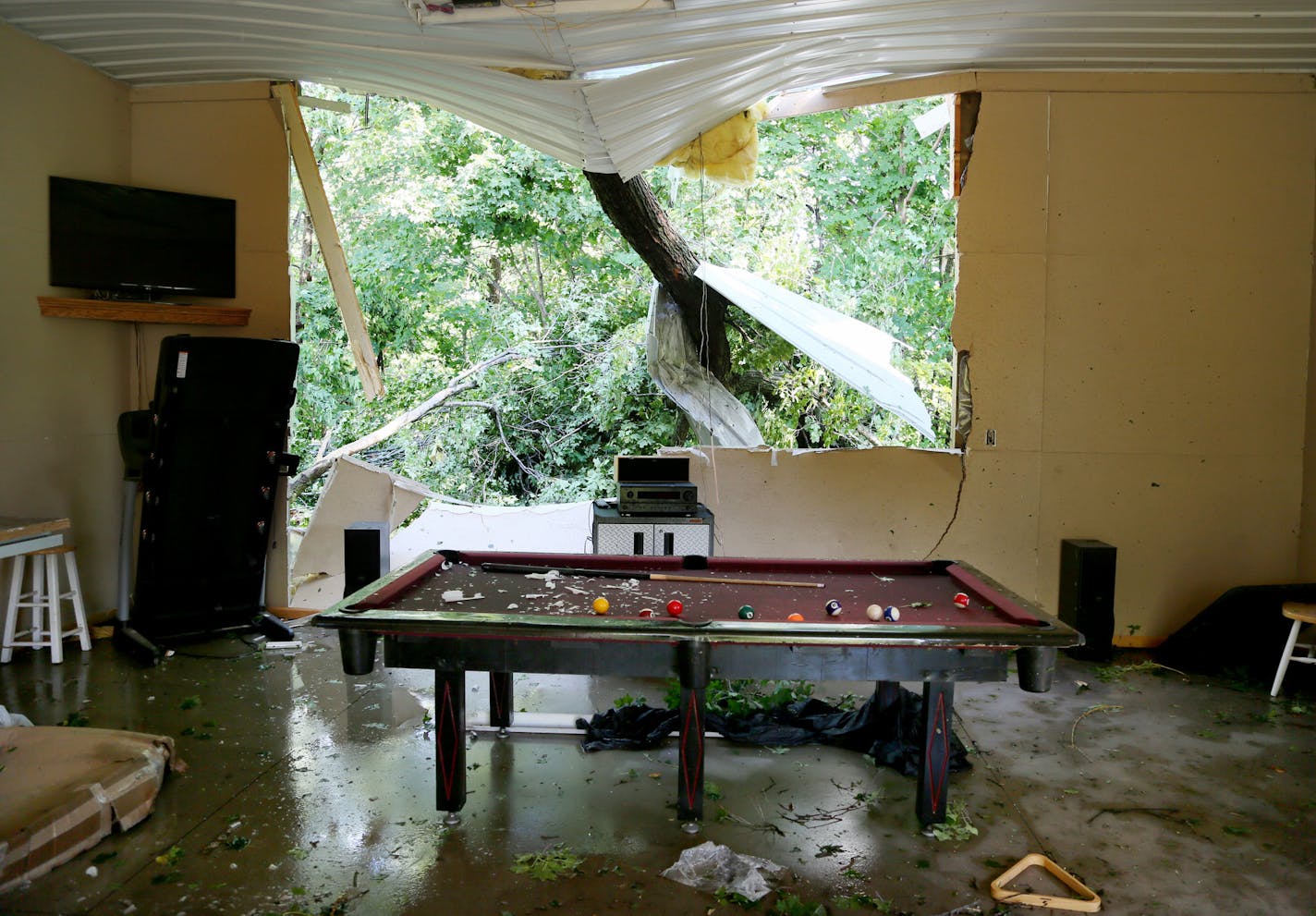 A gaping hole was ripped in a pole barn shop on the property Jason and Monica Bogema, off of Vega Avenue in the Township of Hollywood, where an an EF-1 tornado with 105 mph winds touched down Saturday, July, 18, 2015, near Watertown, MN.](DAVID JOLES/STARTRIBUNE)djoles@startribune.com High winds, heavy rain and a tornado whipped through the Twin Cities late Friday night and early Saturday morning, bringing down trees and knocking out power to thousands.