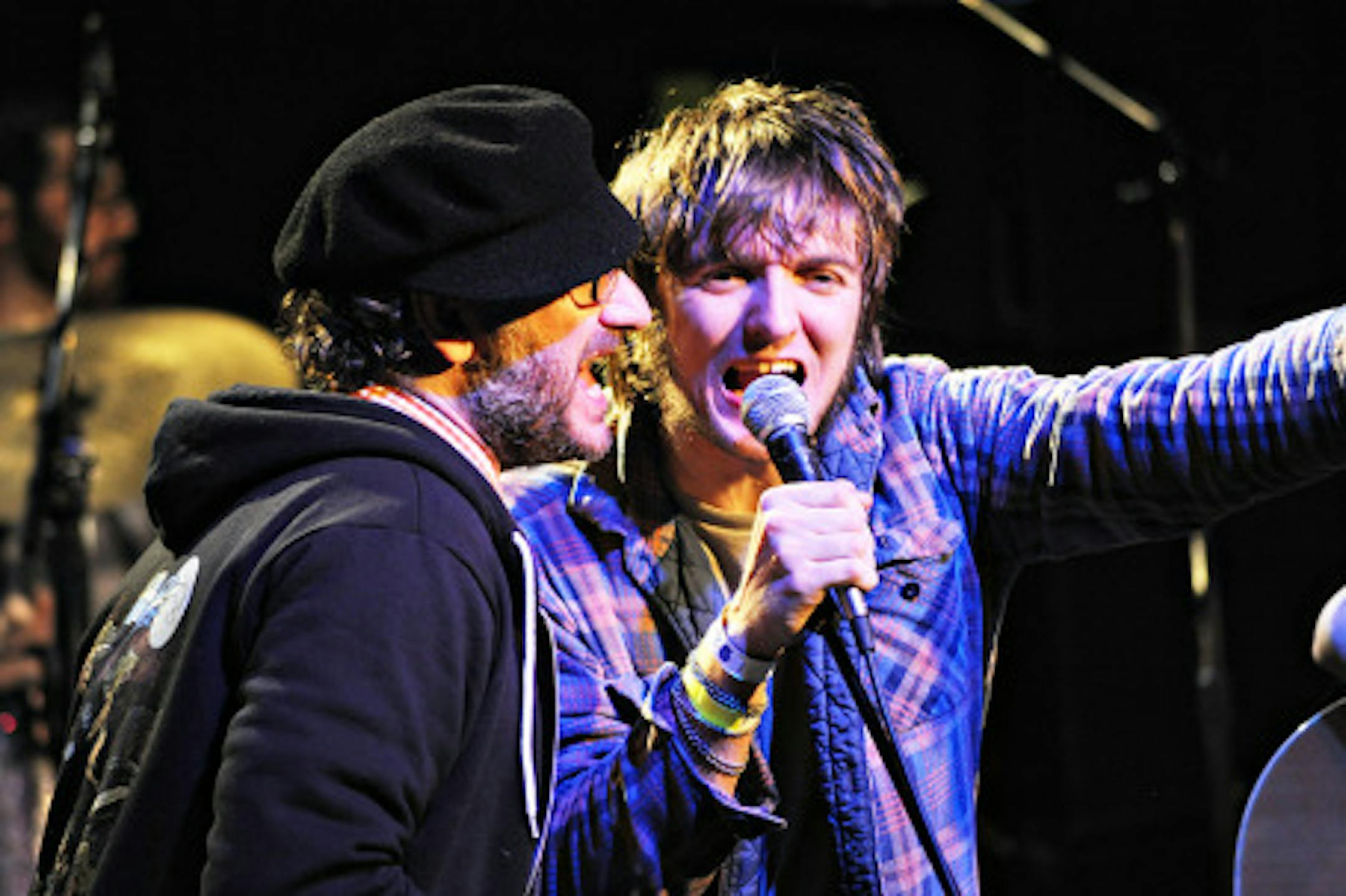 Honeydogs singer Adam Levy, left, shared the mic with "Dose of Thunder" contest winner Erik Hendrickson