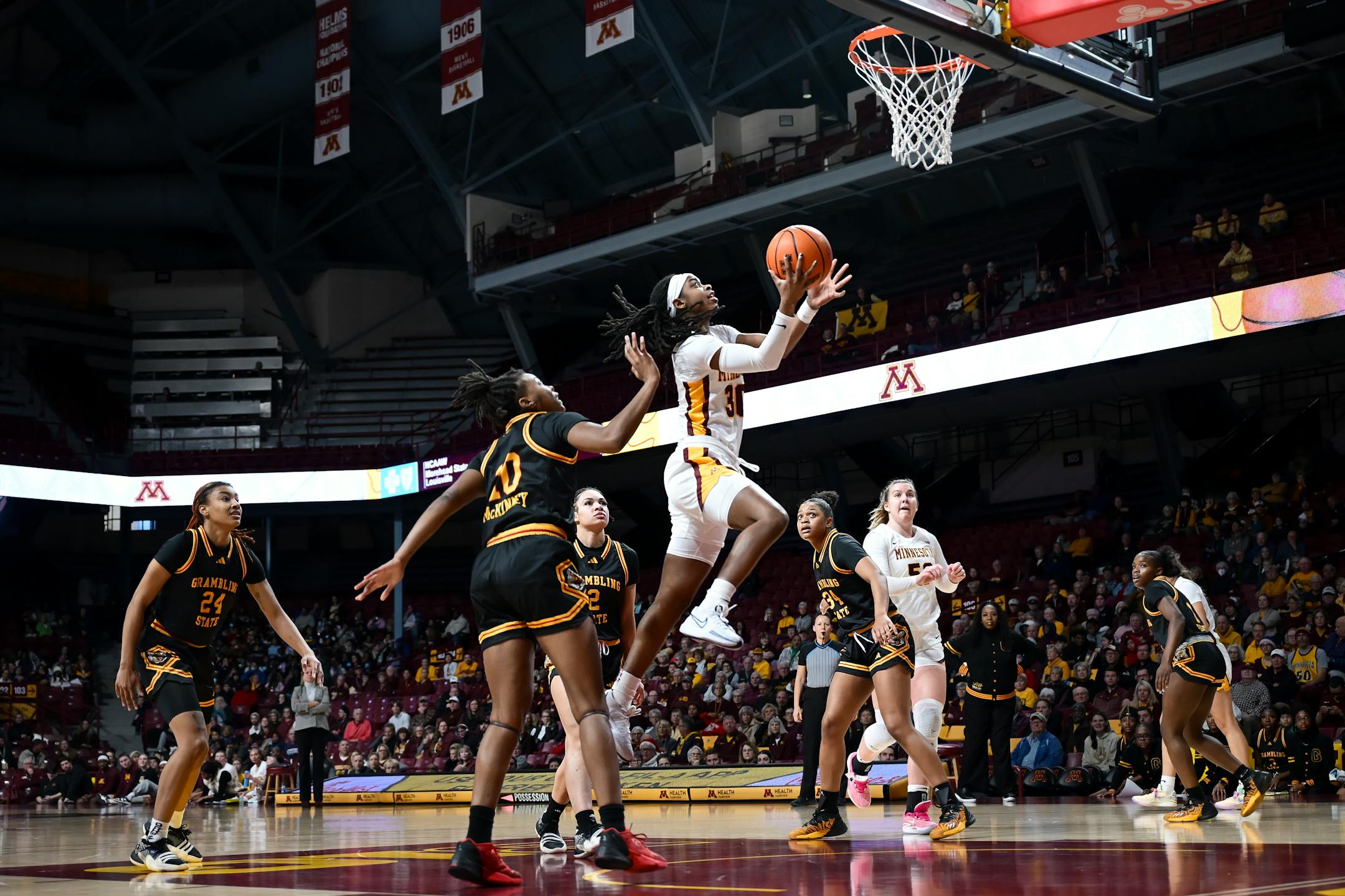 Minnesota Gophers guard Janay Sanders (30) scores a layup against the Grambling Lady Tigers in the first quarter.