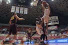 Texas Tech forward Zach Smith (11) drives against Minnesota's defense during the first half of the Puerto Rico Tip-Off college basketball tournament i