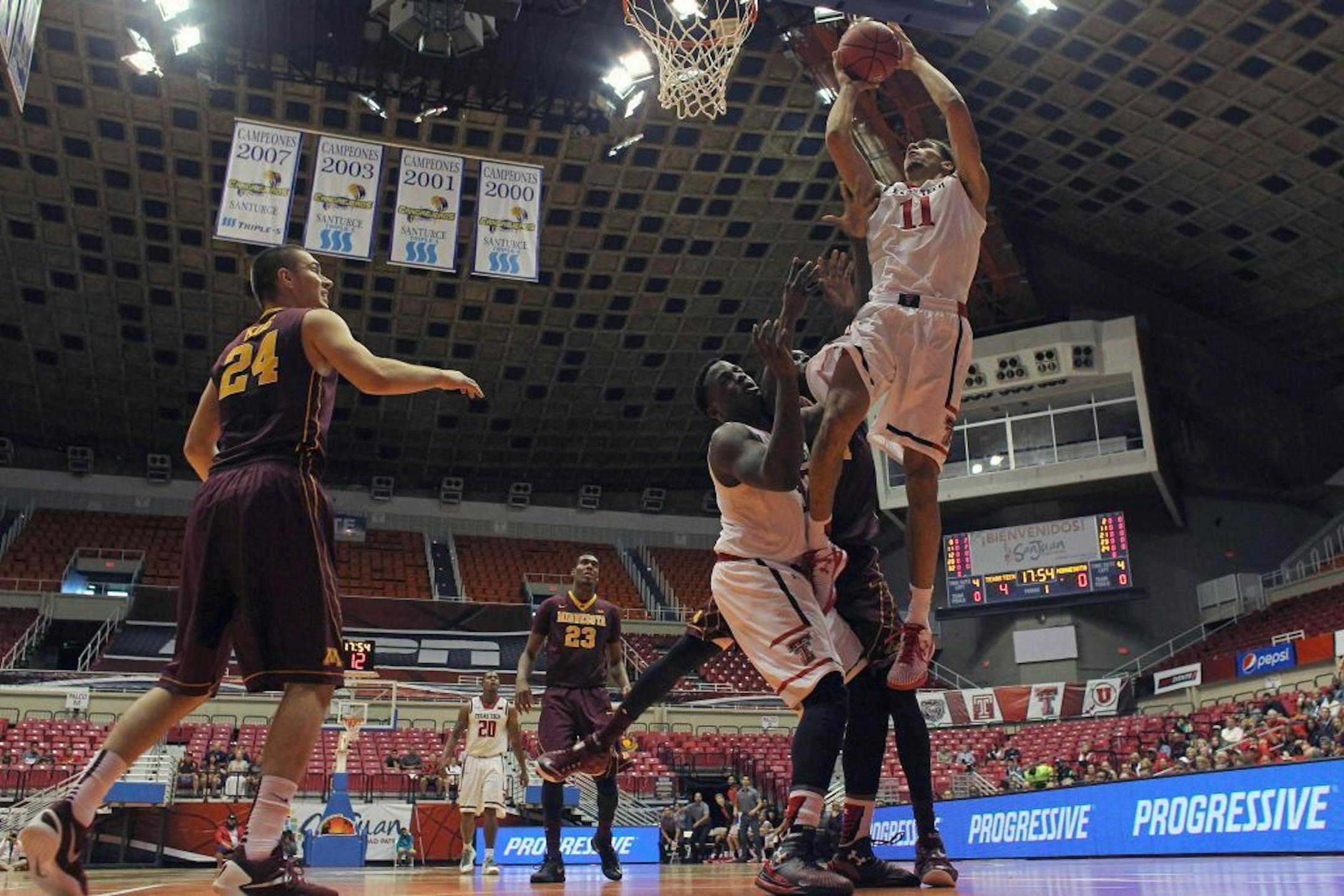 Texas Tech forward Zach Smith (11) drives against Minnesota's defense during the first half of the Puerto Rico Tip-Off college basketball tournament in San Juan, Sunday, Nov. 22, 2015.
