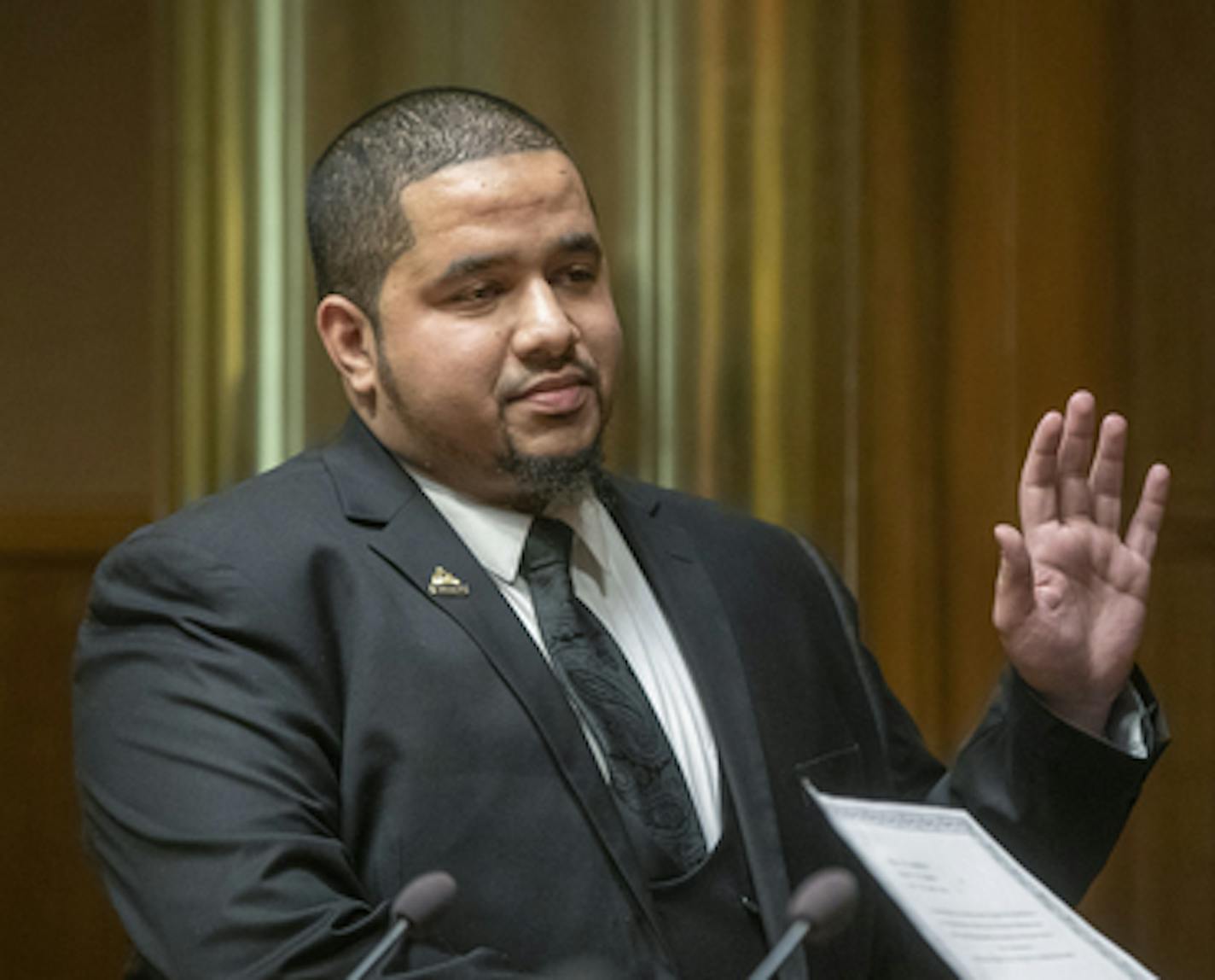 City Council Member Kassim Busuri, left, was sworn in by City Clerk Shari Moore at St. Paul City Hall, Wednesday, February 6, 2019 in St. Paul, MN. Busuri, a local educator, is the first Somali-American to serve on the St. Paul City Council. ] ELIZABETH FLORES &#x2022; liz.flores@startribune.com