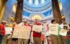 Relatives of elder abuse victims gathered outside the House Chamber Friday to protest inaction by the state Legislature over proposals that would have
