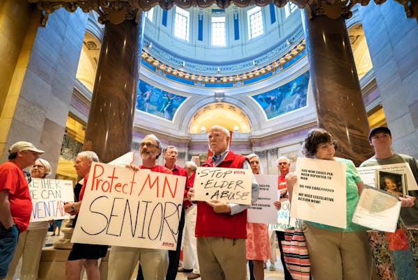 Relatives of elder abuse victims gathered outside the House Chamber Friday to protest inaction by the state Legislature over proposals that would have