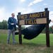 Major League Soccer President and Deputy Commissioner Mark Abbott, a native of Oakdale, Minn., unveils the updated sign with his sister Heather Abbott