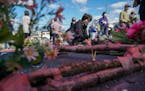 ATLANTA — BC-OPED-CHOI-ATLANTA-SHOOTINGS-GENERATIONS-ART-NYTSF — Korean-American Christians laid flowers on Sunday at Gold Spa after they gathered