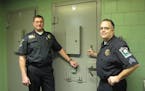 Police Chief Rick Peterson, left, and Capt. Greg Weiss (then a sergeant) were shown at the holding cells of the city's old police department in 2011.