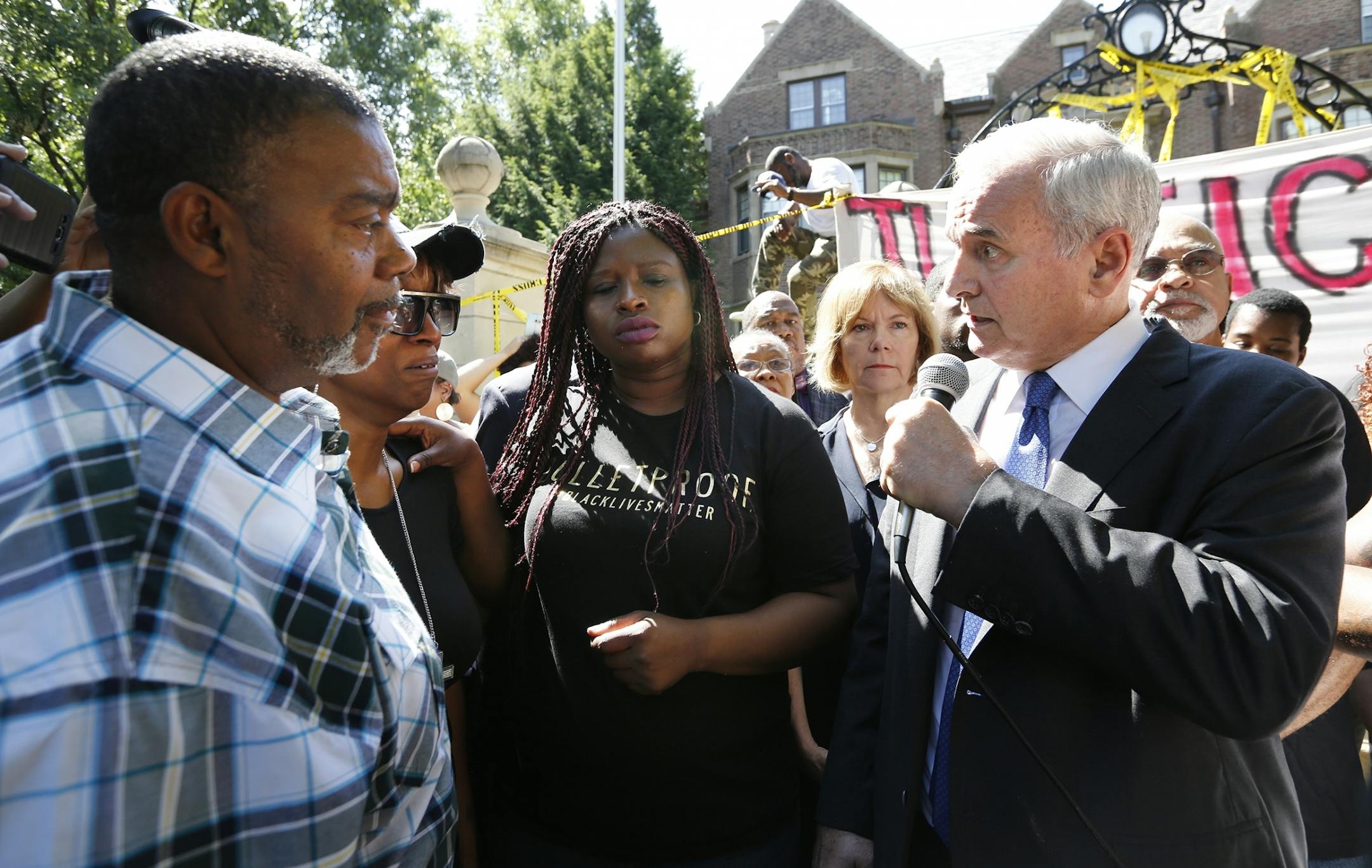 Gov. Dayton speaks with Diamond Reynolds (wearing glasses), the girlfriend of Philando Castile, second from left, during a press conference at the governor's residence. Castile was fatally shot during a traffic stop in Falcon Heights on Wednesday, July 6, 2016.