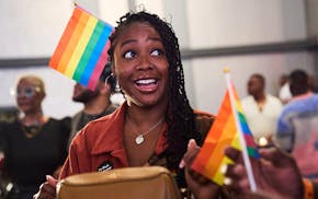 Troisha Busano, of Washington, attends the opening gala of DC Black Pride with her brother and sister, Friday, May 23, 2025, at the Capitol Hilton in