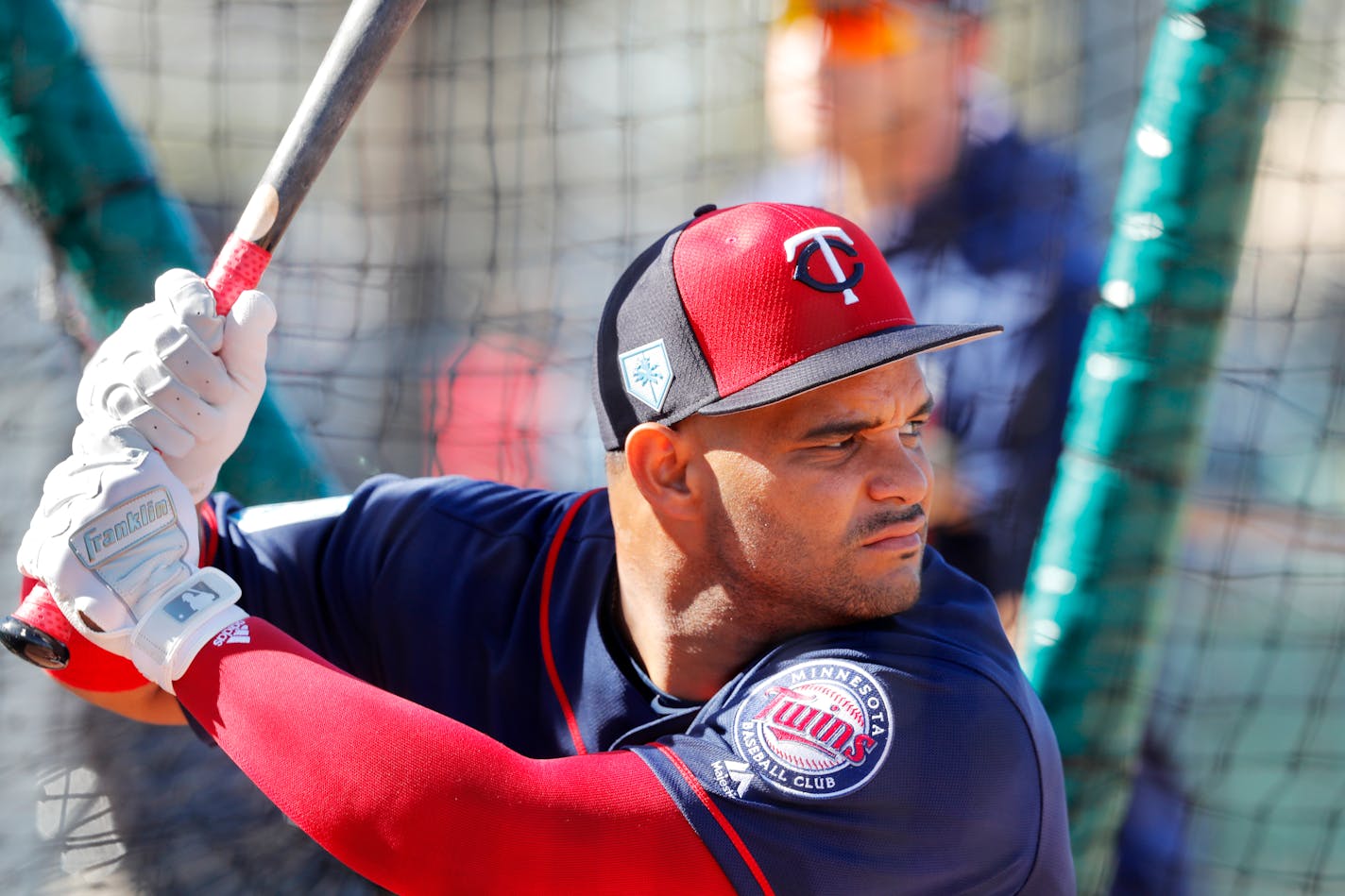 Minnesota Twins catcher Tomas Telis hits in the batting cage, as pitchers and catchers report for their first workout at their spring training baseball facility in Ft. Myers, Fla., Thursday, Feb. 14, 2019. (AP Photo/Gerald Herbert)