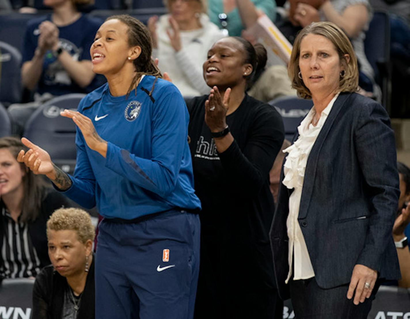 Minnesota Lynx Seimone Augustus cheered on teammates from the bench.