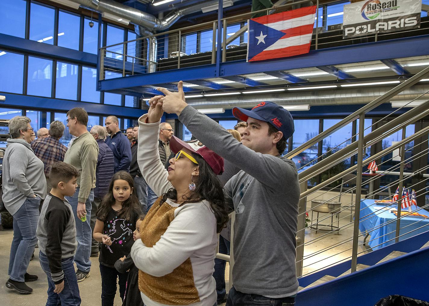 Karen Lopez Rivera, and her husband Edwin Colon Perez danced to salsa music during a community welcome party and open house that Polaris hosted for families from Puerto Rico and the community at the Polaris manufacturing plant, Monday, February 17, 2020 in Roseau, MN. ] ELIZABETH FLORES &#x2022; liz.flores@startribune.com ORG XMIT: MIN2003021009540825