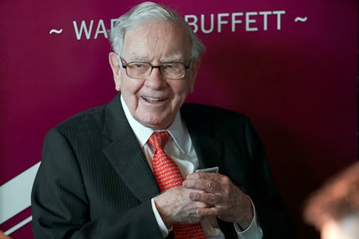 FILE - In this May 5, 2019, file photo Warren Buffett, Chairman and CEO of Berkshire Hathaway, smiles as he plays bridge following the annual Berkshire Hathaway shareholders meeting in Omaha.