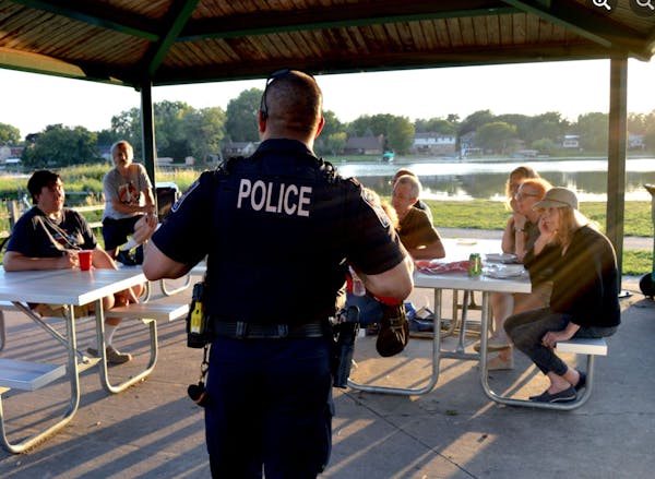 A Brooklyn Center police officer visited a National Night Out gathering on Aug. 1.