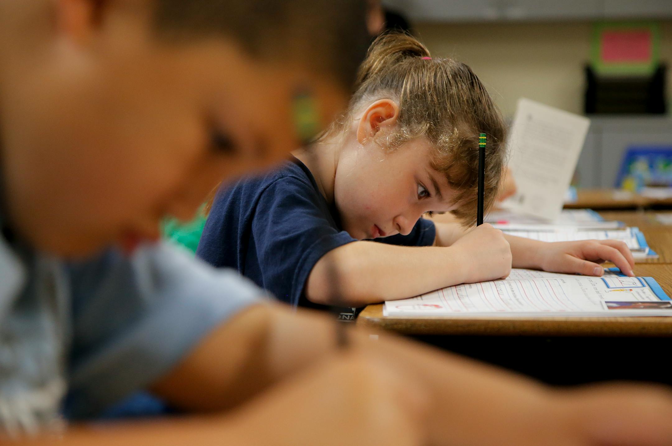 Zoe White practices writing in cursive at St. Mark�s Lutheran School in Hacienda Heights, Calif., Thursday, Oct. 18, 2012. Bucking a growing trend of eliminating cursive from elementary school curriculums or making it optional, California is among the states keeping longhand as a third-grade staple. (AP Photo/Jae C. Hong)