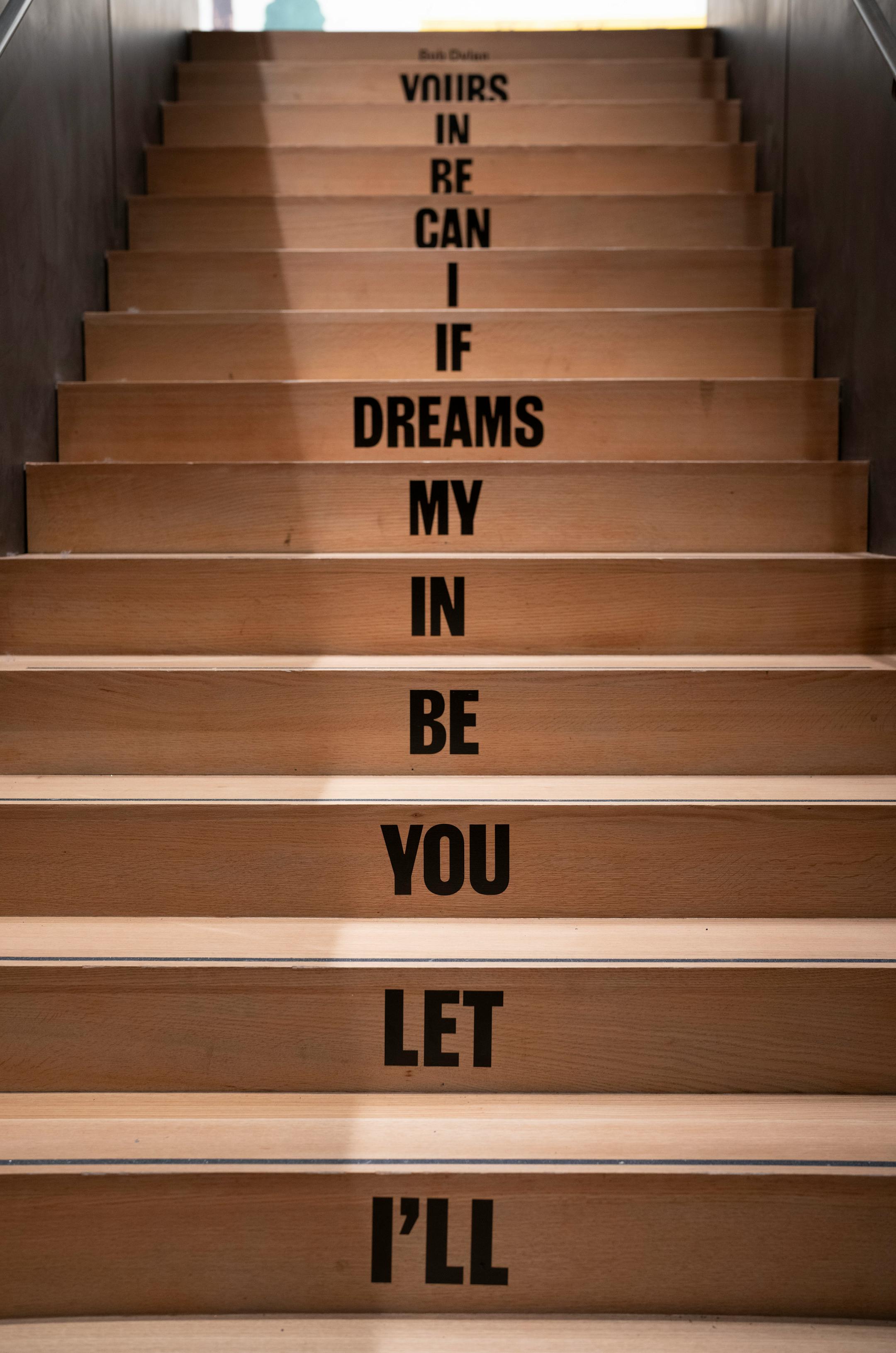 The stairway to the second floor of the Bob Dylan Center in Tulsa, Okla. bears a well known snippet of the lyrics from Bob Dylan's 1963 song "Talkin' World War III Blues" on Monday, May 9, 2022.