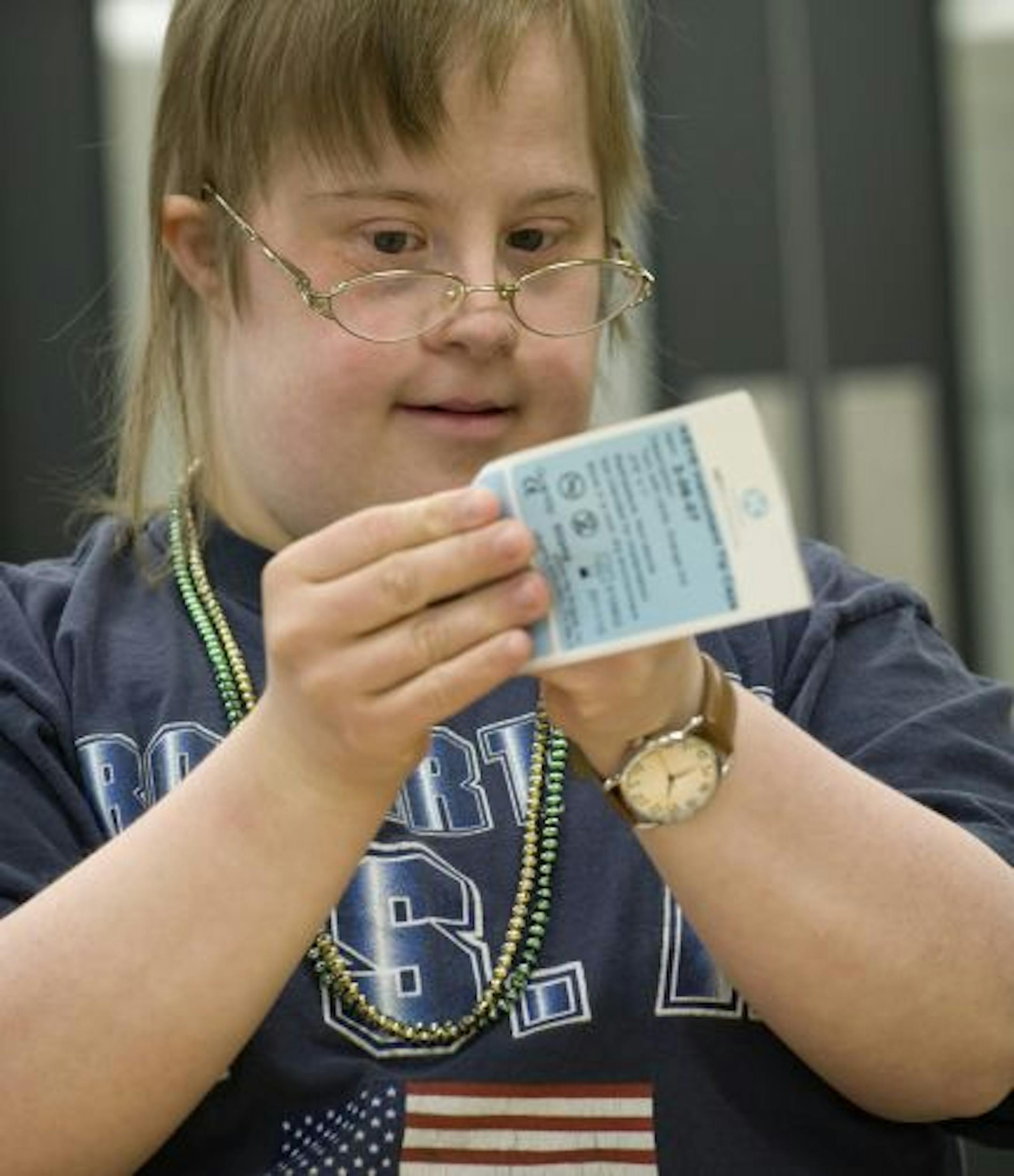 Lifeworks employee Misty Colby assembled product sample envelopes at Key Surgical in Eden Prairie.