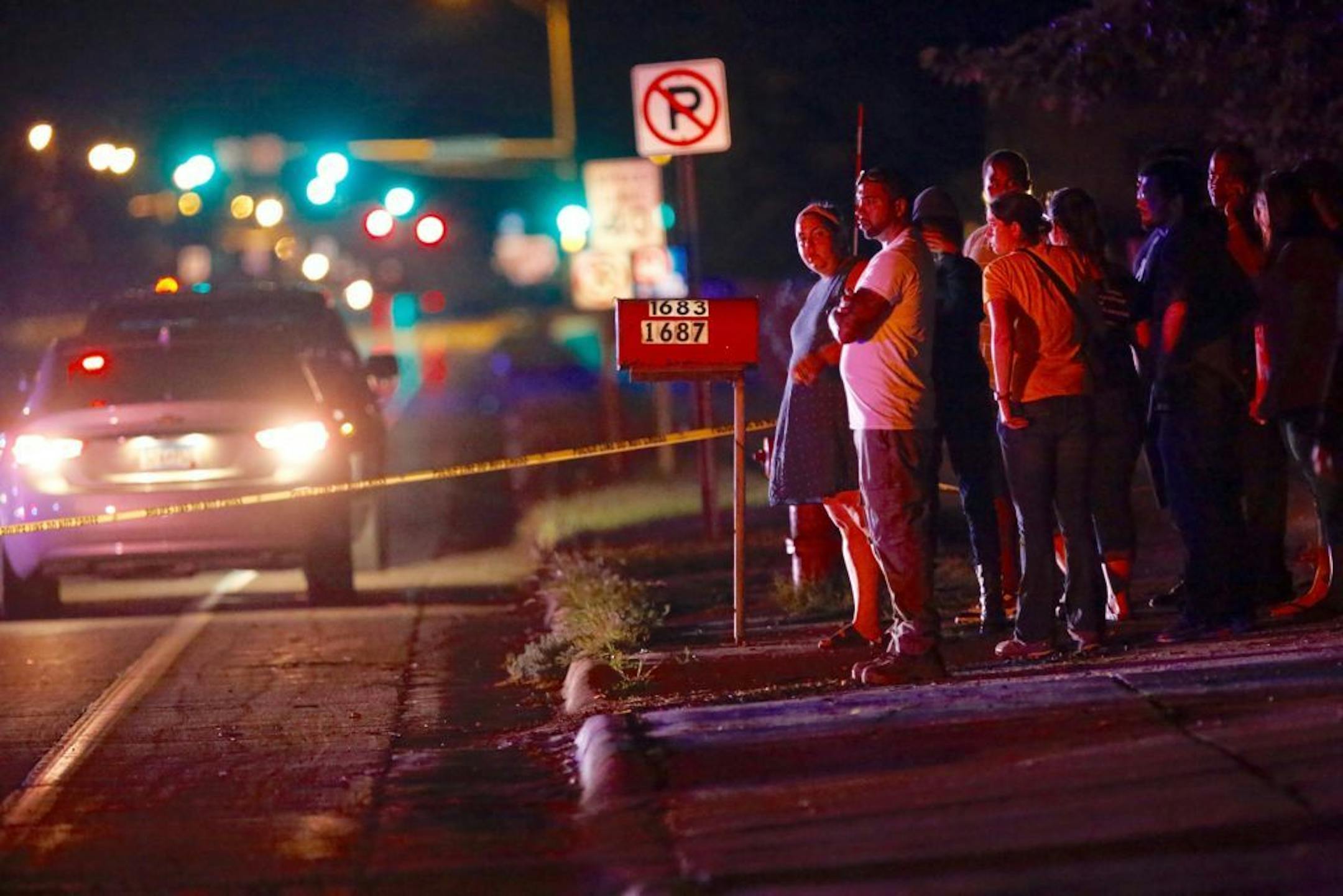 A crowd gathers at the scene of a police involved shooting in Falcon Heights involving St. Anthony Police officers on Wednesday, July 6, 2016.