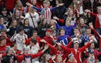Centennial fans show their support for both their girls High School team and the American woman who just won a gold medal in the Olympics. ] Class 2A 