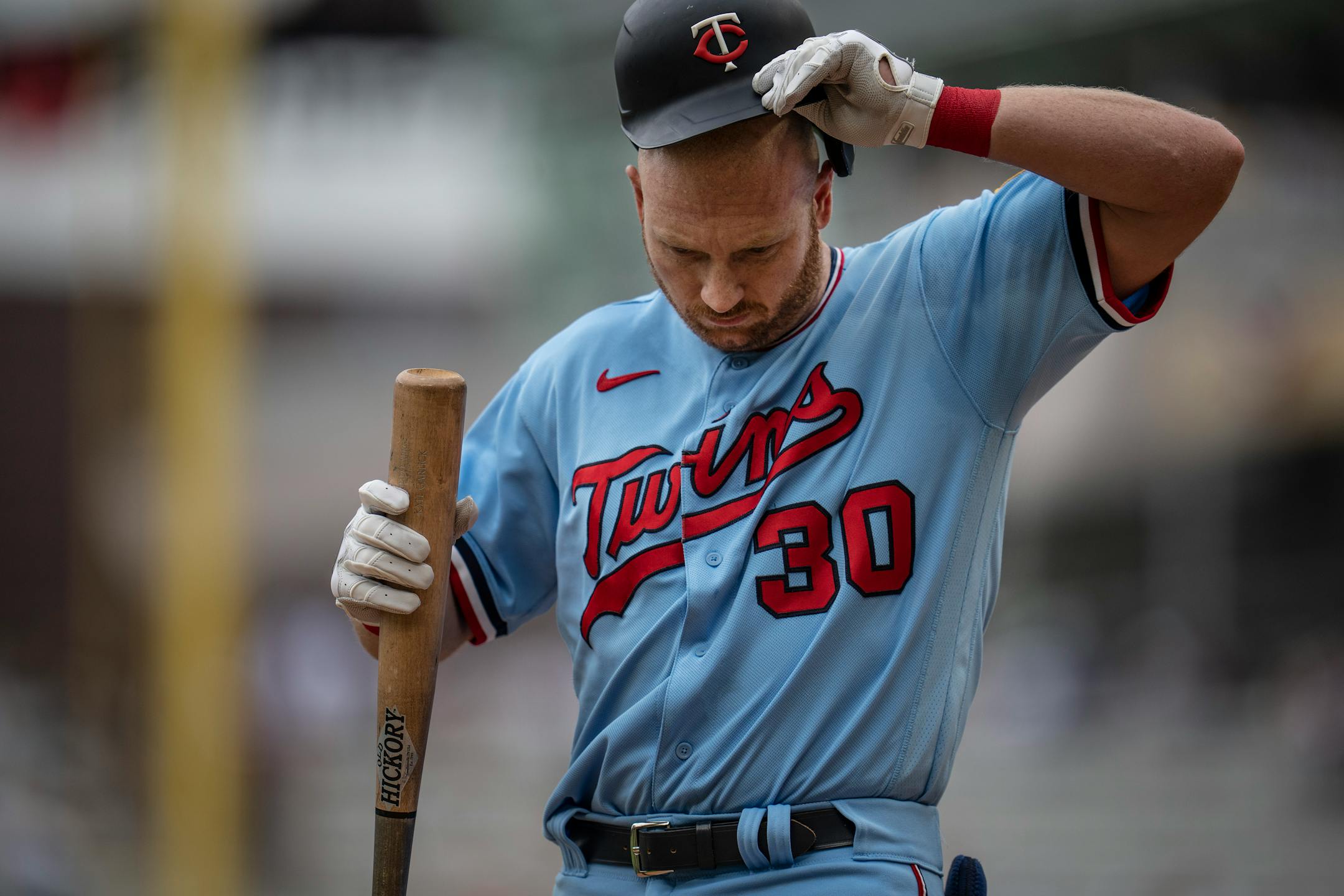 Minnesota Twins hitter Kyle Garlick (30) hit a fly ball for an out in the ninth inning.