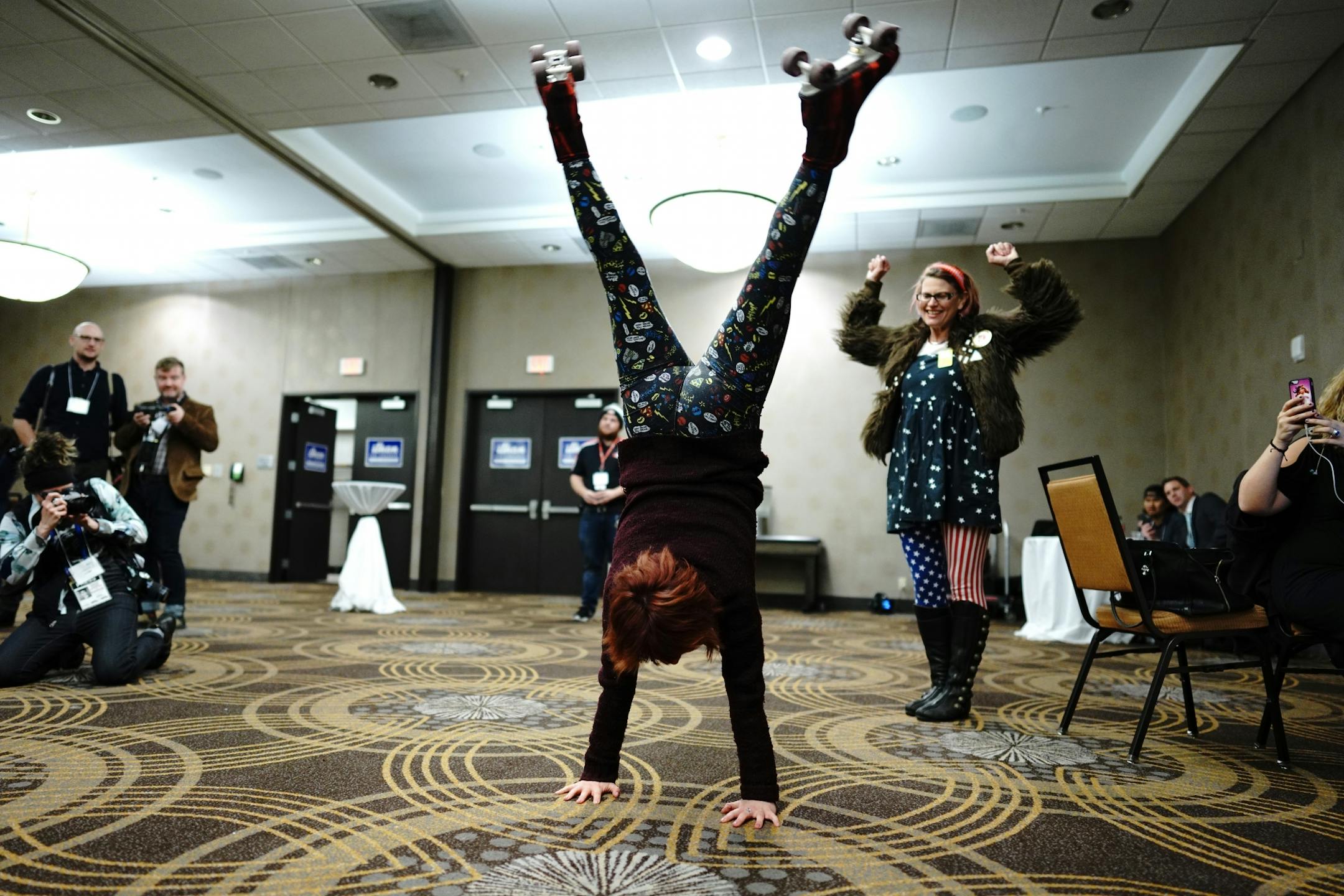 Majentah Aquarious performs roller skate tricks as supporters trickled in to the party.