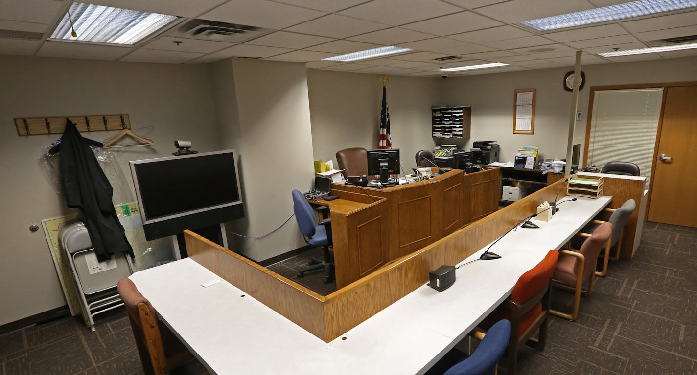 US Immigration Courtroom in Bloomington MN., photographed on 3/11/14. One by one, the realities of an overwhelmed immigration system came walking into the courtroom in handcuffs and prison-issue flip-flops, Judge William J. Dickerson, who has seen it all in 40 years, presiding. On one recent day in a windowless room with mismatched chairs and tired wood paneling of a basement man-cave, Dickerson, one of three U.S. Immigration Court judges in Minnesota, heard 22 cases of people being detained for