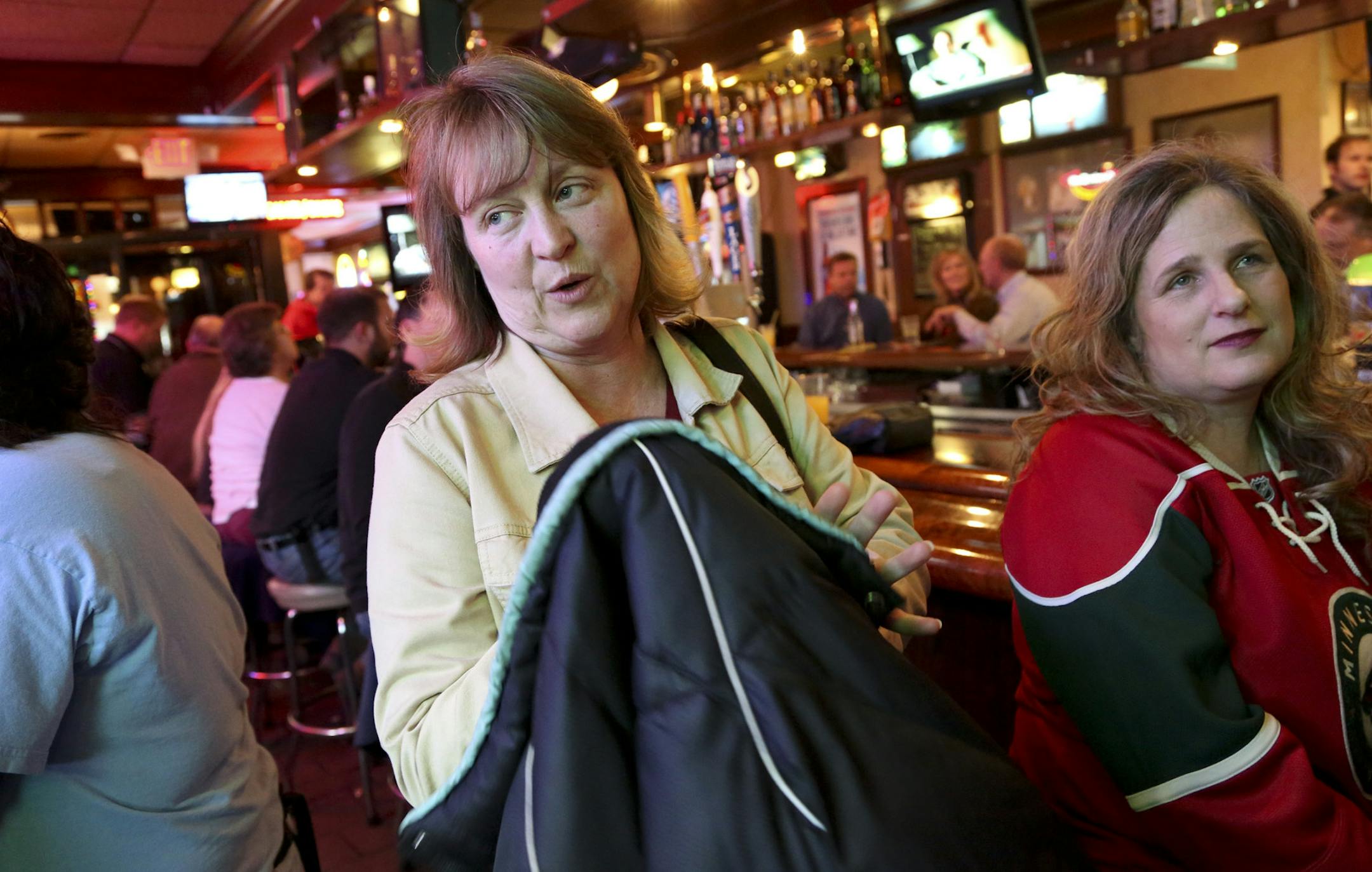 With Karen Chartrand, 45, right, listening and agreeing Maureen Meizinger, 47, talked about how the alcohol tax will hurt some working class people during happy hour at Obb's in St Paul, Min., Wednesday, April 17, 2013. ] (KYNDELL HARKNESS/STAR TRIBUNE) kyndell.harkness@startribune.com