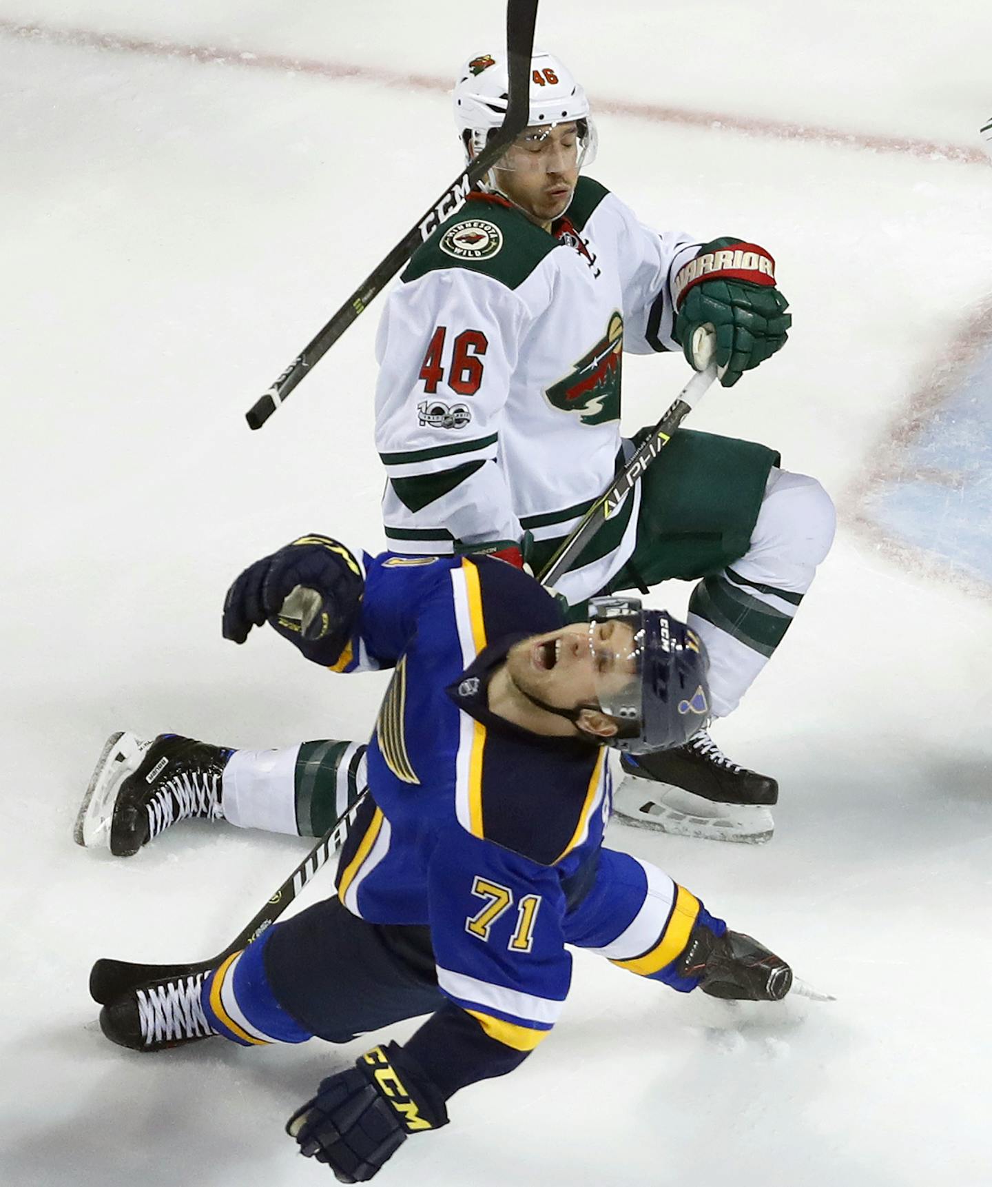 St. Louis Blues' Vladimir Sobotka, of the Czech Republic, loses his stick after colliding with Minnesota Wild's Jared Spurgeon (46) during the third period in Game 4 of an NHL hockey first-round playoff series Wednesday, April 19, 2017, in St. Louis. The Wild won 2-0. (AP Photo/Jeff Roberson)