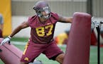 Minnesota football players, including Gaelin Elmore, took to the field for drills during the first practice of the season for Gophers football at Gibs