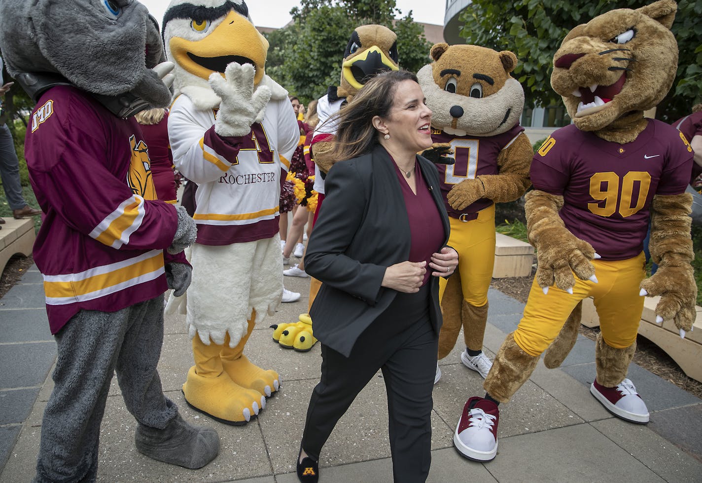 Joan Gabel, the University of Minnesota's first female president, greeted many, including all the Minnesota mascots, during the "Procession to Scholars Walk, as she made her way to the steps of Northrop Memorial Auditorium for welcome remarks, Friday, September 20, 2019. ] ELIZABETH FLORES &#x2022; liz.flores@startribune.com