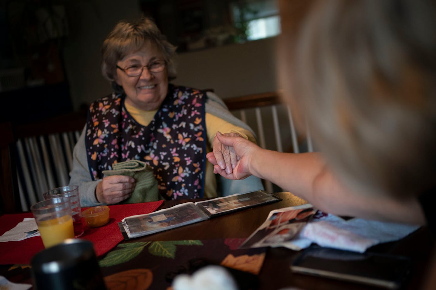 Betty Bednarowski, 79, smiles as her daughter Susan Ryder reaches out to hold her hand, Wednesday, Dec. 1, 2021, in Rotterdam Junction, N.Y. (AP Photo/Wong Maye-E)