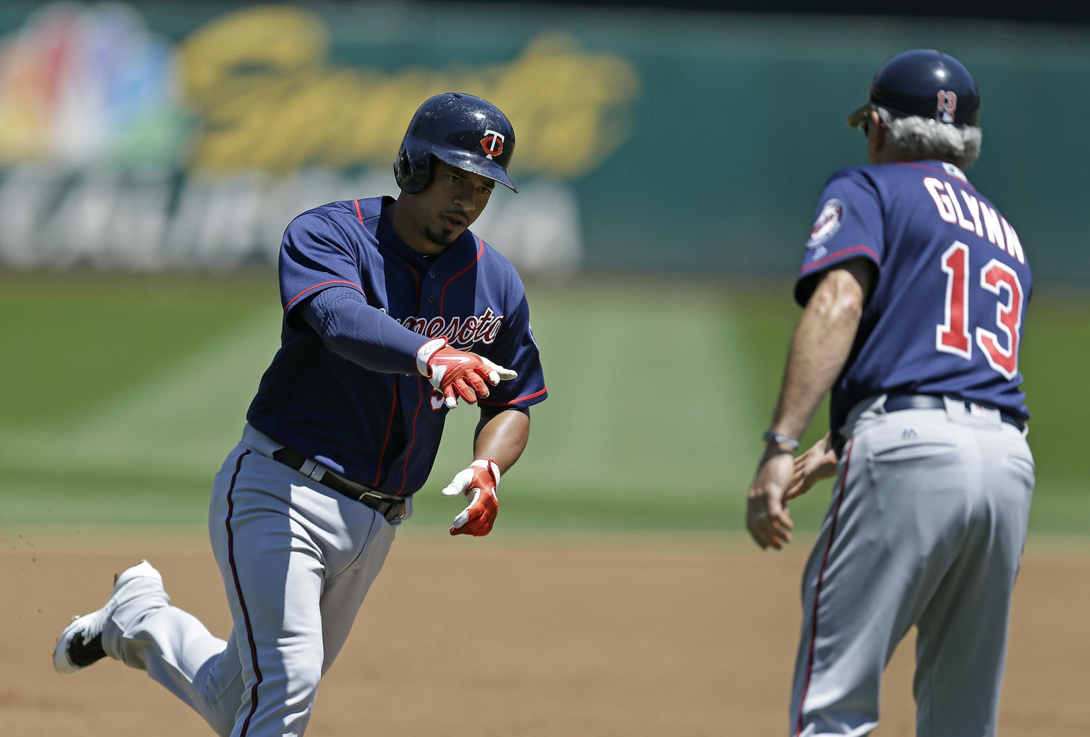 The Twins’ Eduardo Escobar was congratulated by third base coach Gene Glynn after hitting a two-run home run off Oakland’s Jharel Cotton in the first inning Sunday, giving the Twins an early 3-0 lead. They eventually lost 6-5 in 12 innings.