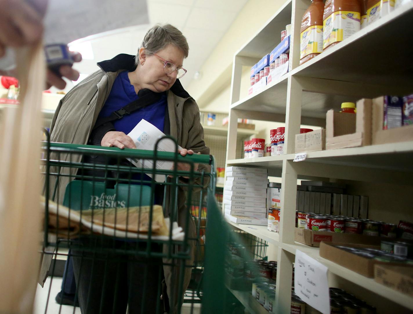 Linda McFeters looked at her options as she shopped at the Walker food self. ] (KYNDELL HARKNESS/STAR TRIBUNE) kyndell.harkness@startribune.com Visited Access North and a food shelter to talk with residents that depend on disability benefits in Walker Min., Tuesday, December 15, 2015. For a growing number of disabled Minnesotans, a little-known federal fund on the brink of insolvency has become a financial lifeline.